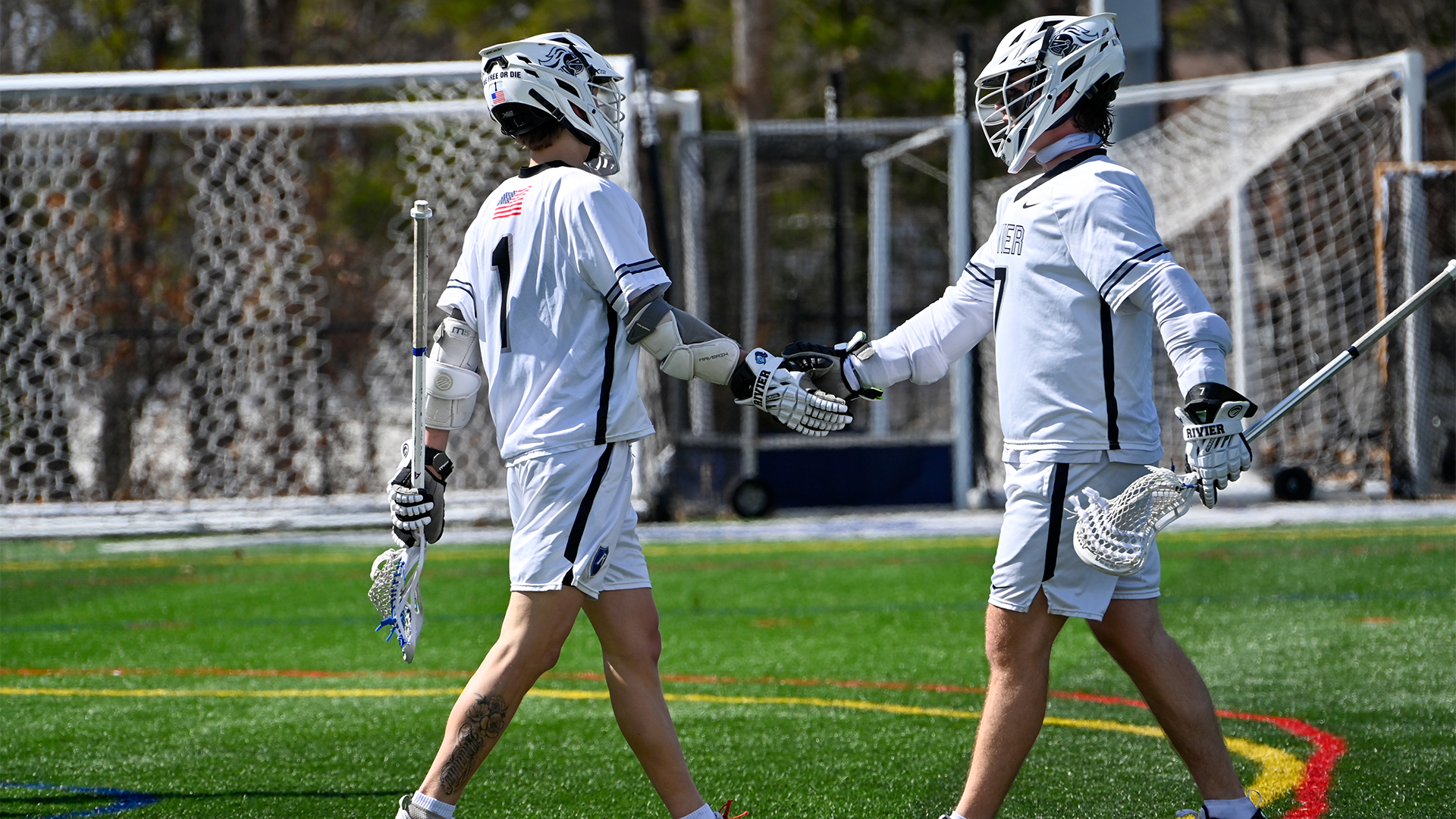 Andrew Nee and Mason Schultz high-fiving 