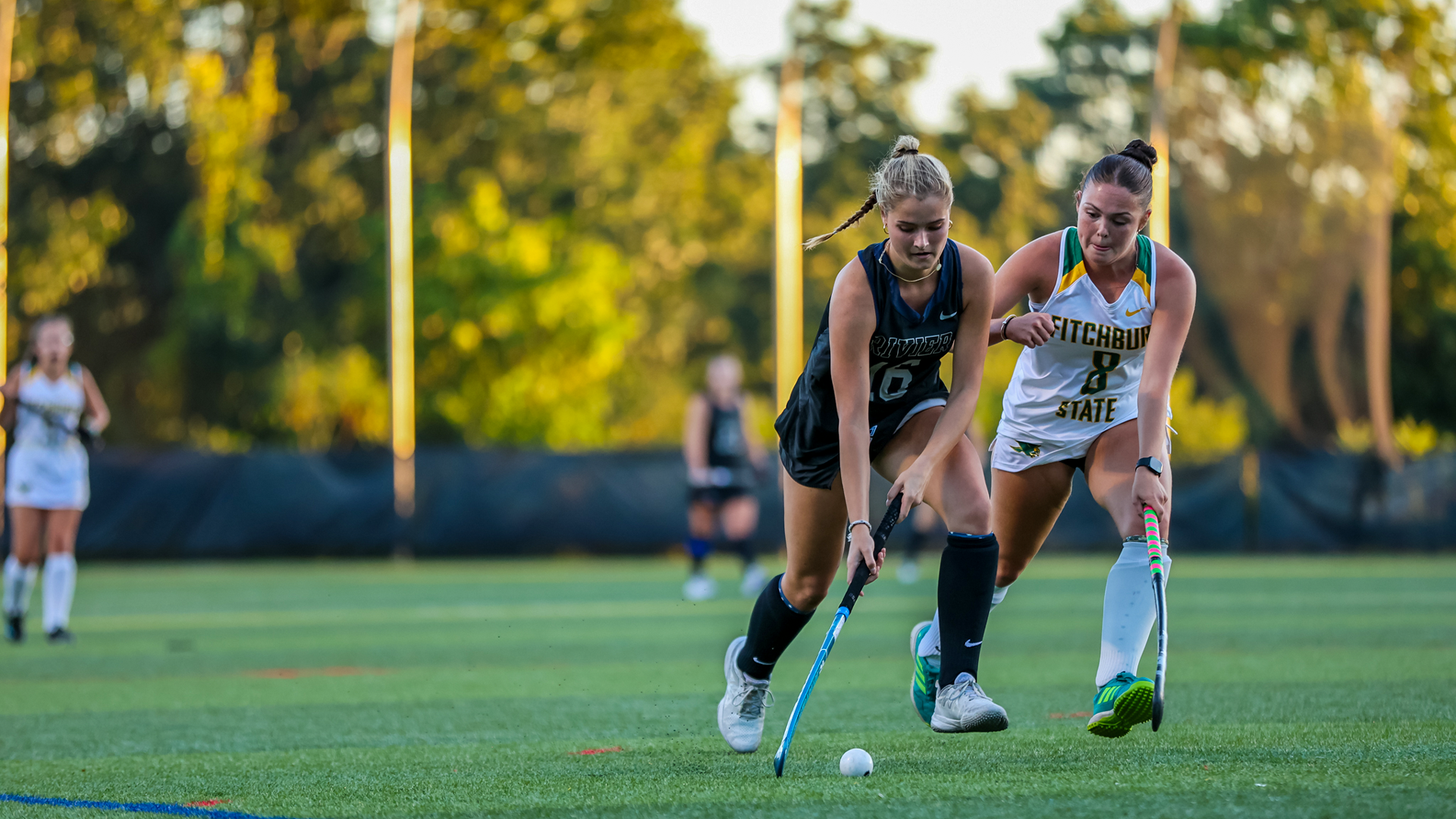 Lexi Davies running past a defender 