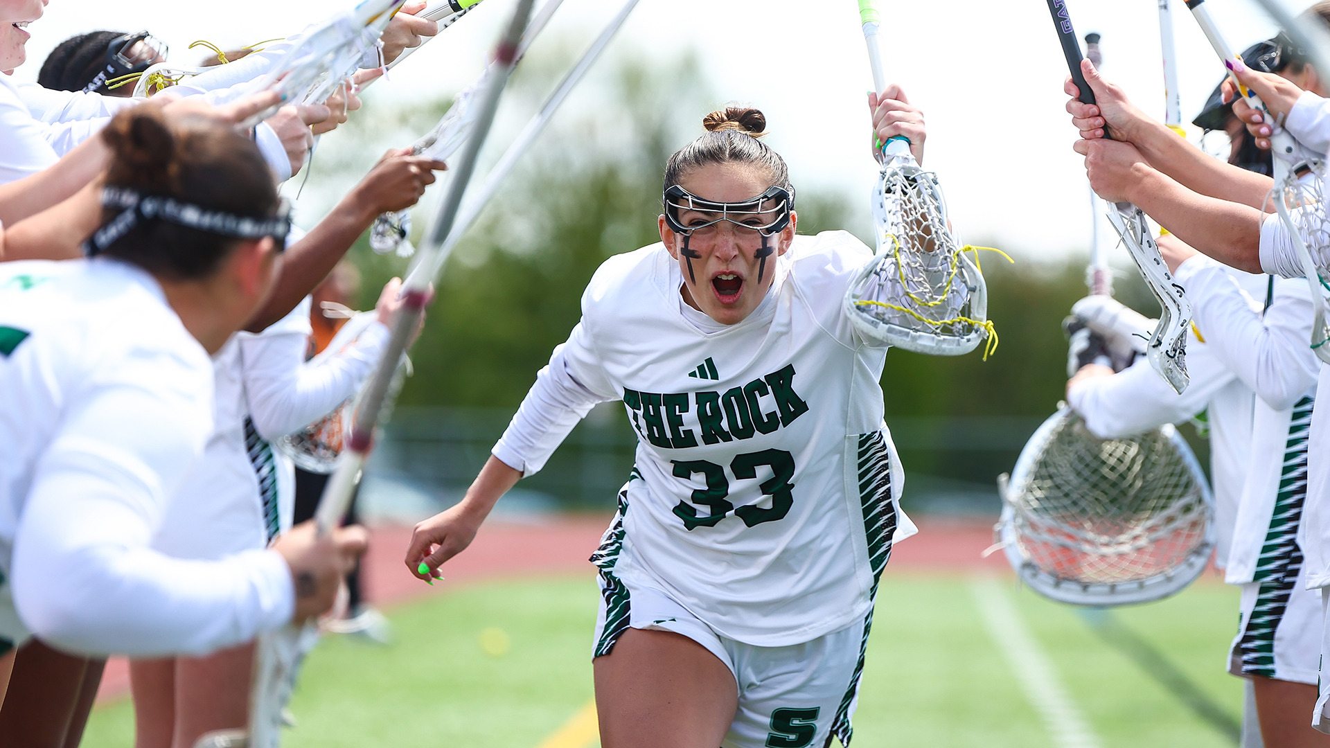 Abby Fink runs through pregame tunnel