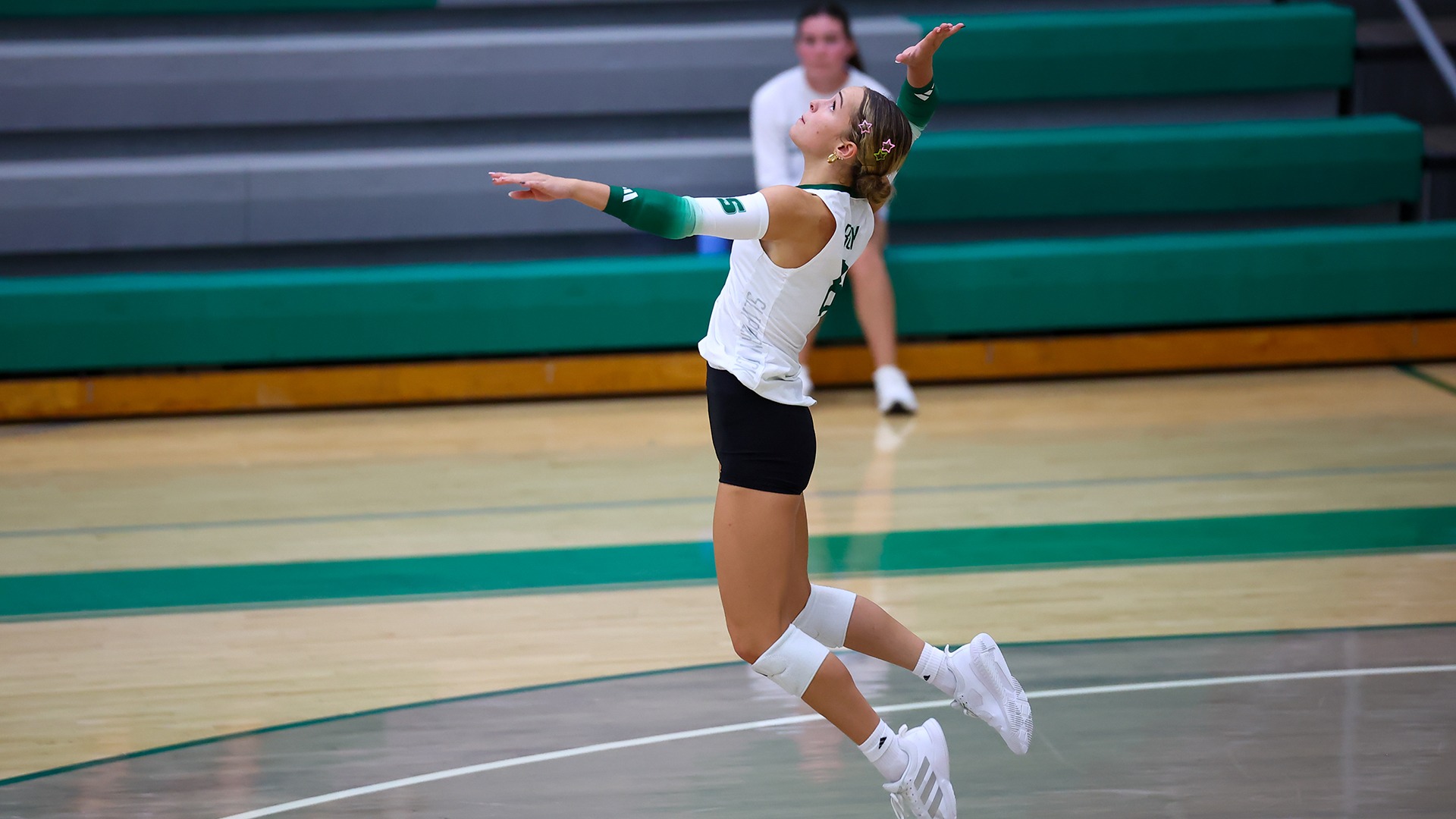 Ellie Friedrichs serving vs. Bloomsburg