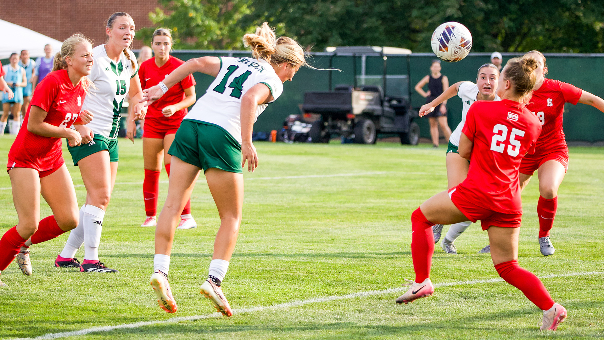 Photo of Leah Walter scoring a header goal vs Edinboro