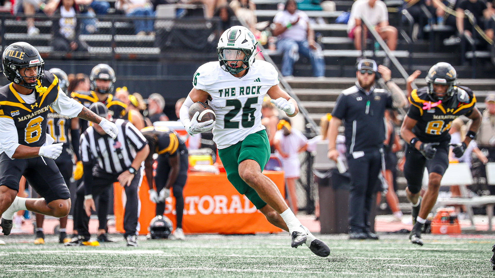 Carmen Metcalfe runs with the ball in a game at Millersville
