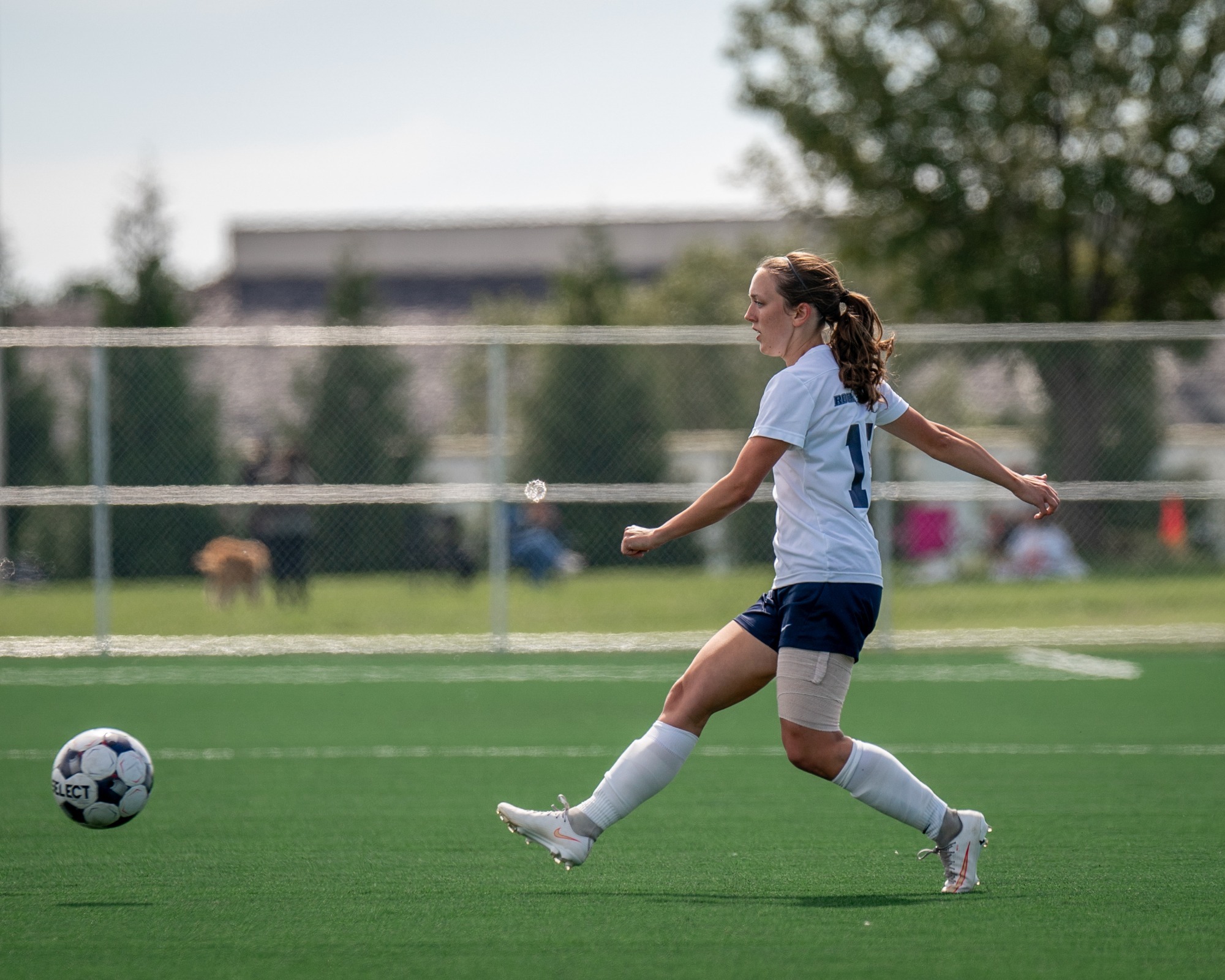 Zoe Larson plays a ball