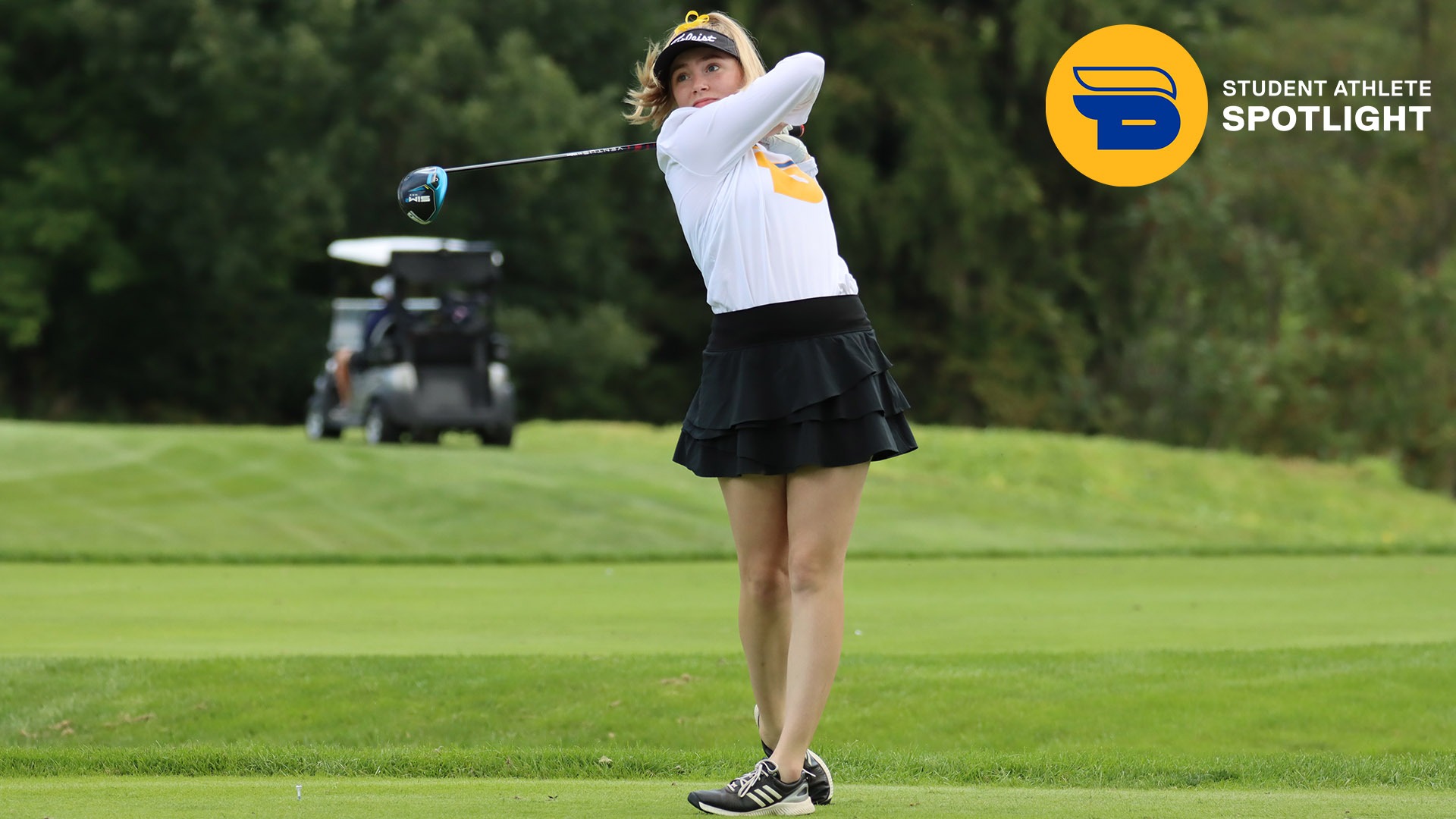 TMU golfer Abigail Dove holds a follow through and watches the flight of her ball.