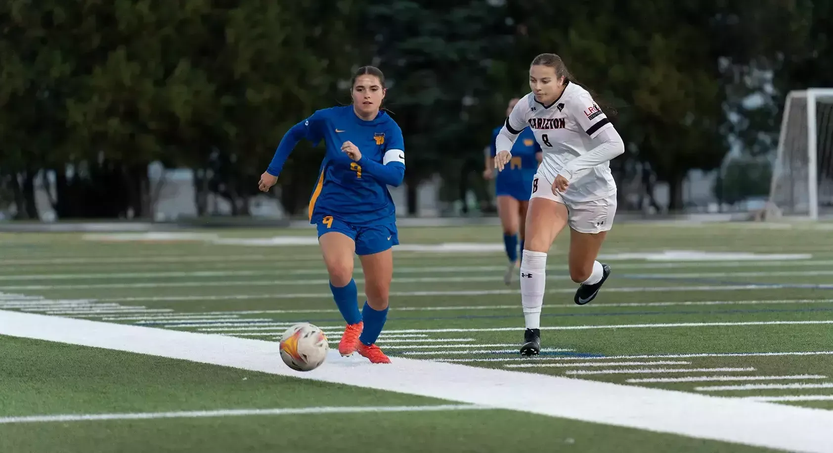 TMU Bold defender Amanda Rankin races for the ball against the Carleton Ravens.