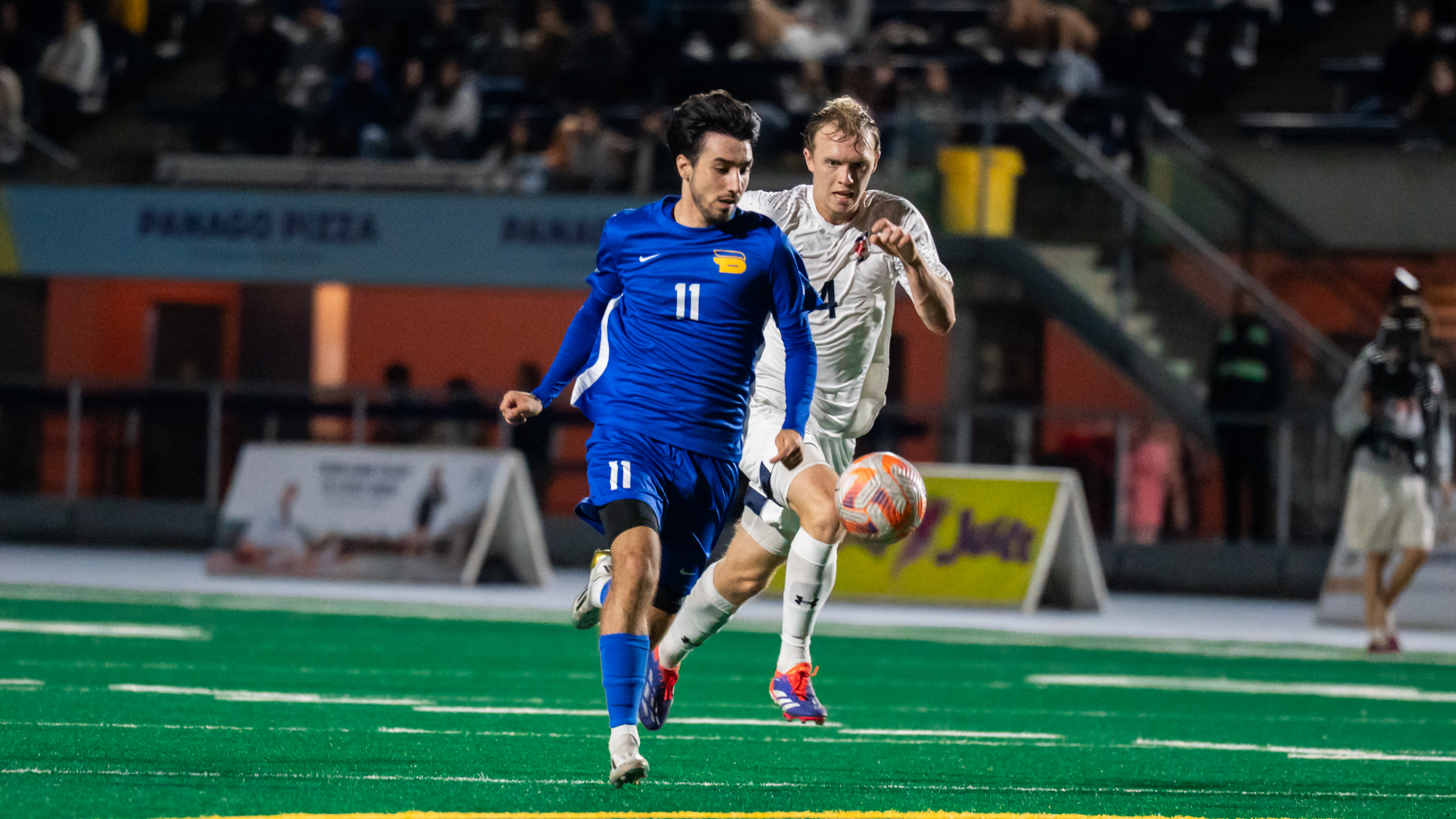 Justin Santos controls the ball