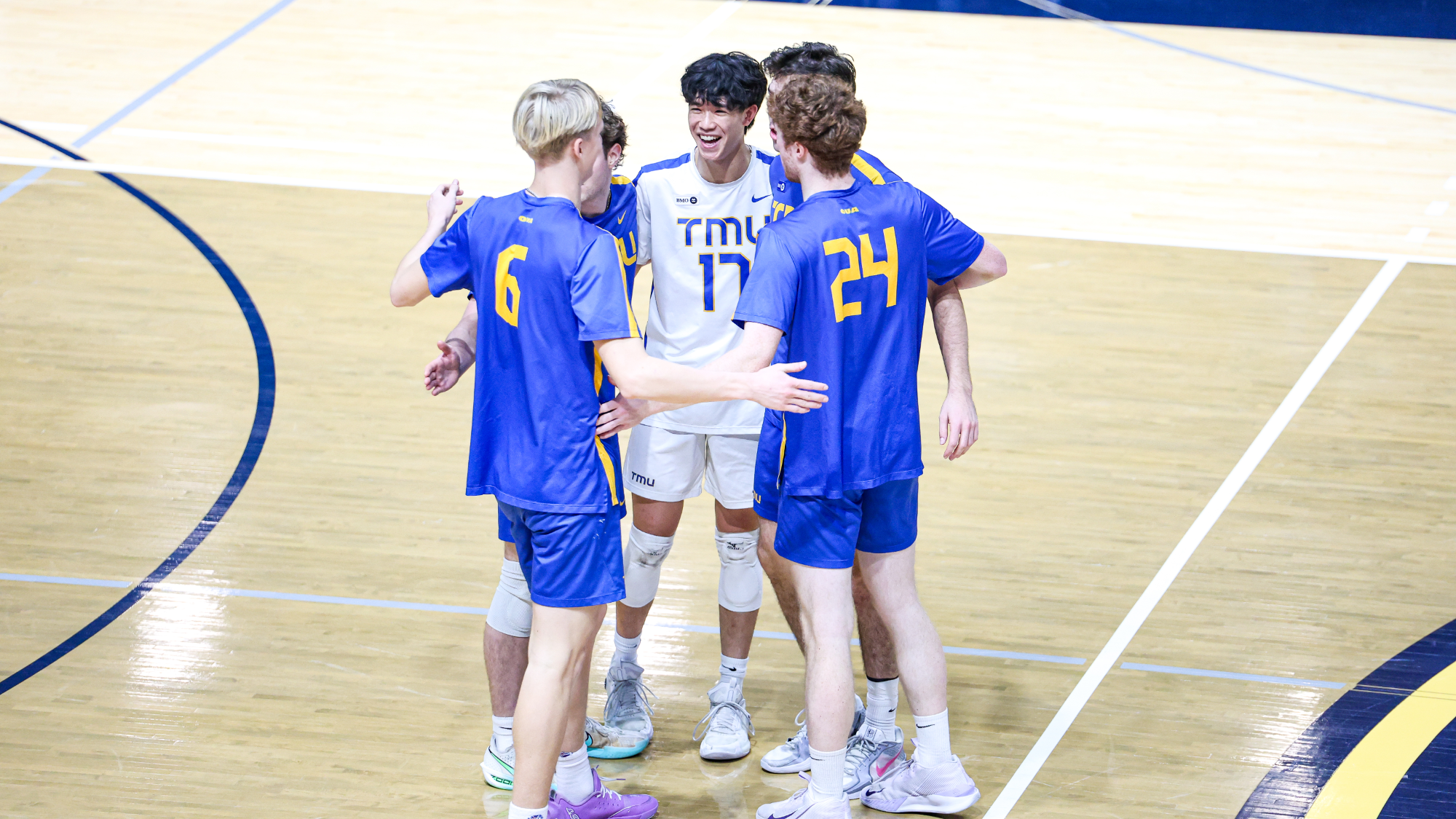 TMU players huddle after a point