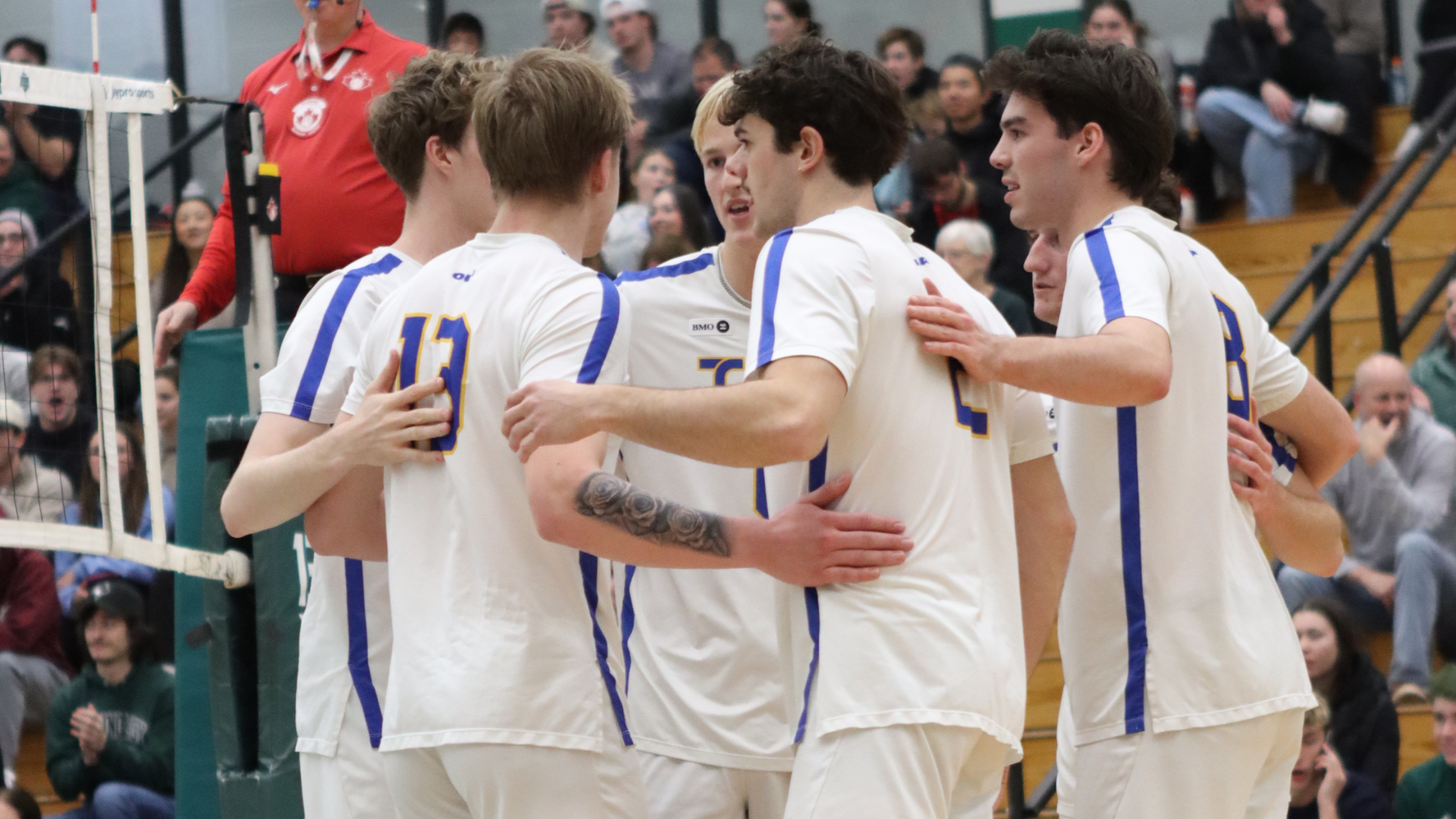 Bold players huddle after winning a point