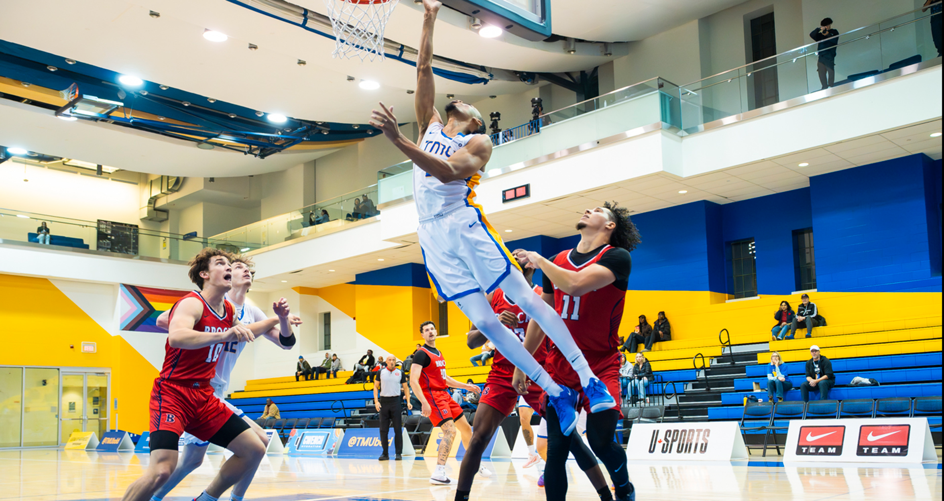 TMU Bold guard Deandre Goulbourne elevates at the rim against the Brock Badgers.