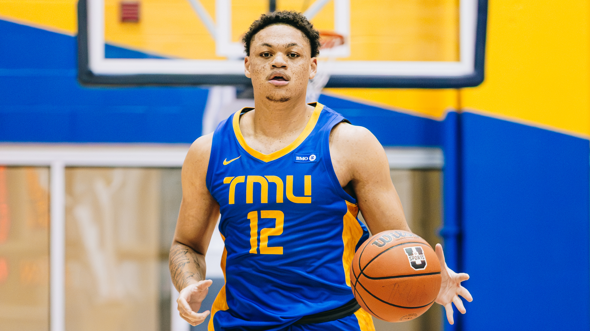 Aaron Rhooms dribbles the ball