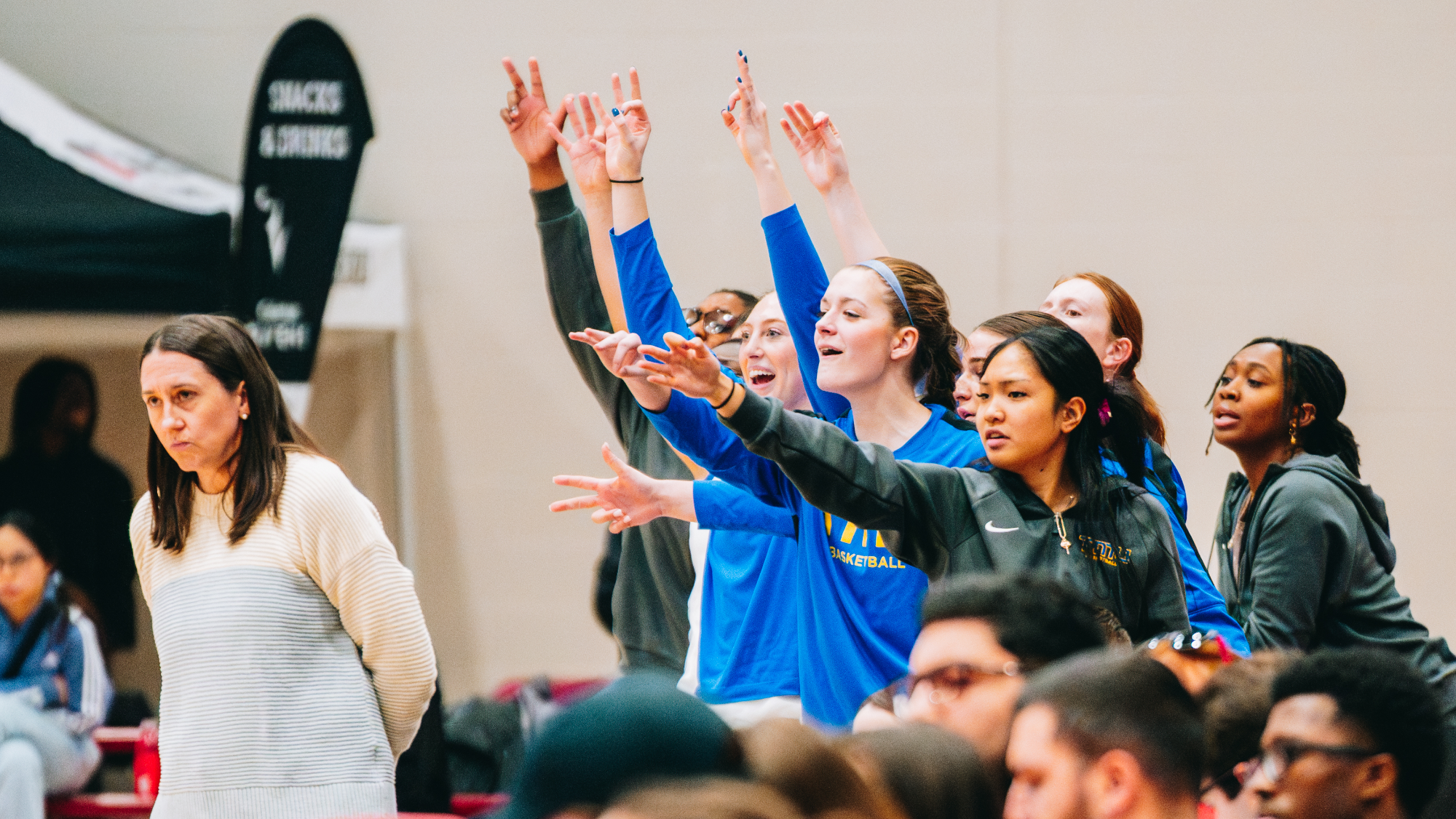 Bold players celebrate after scoring a basket