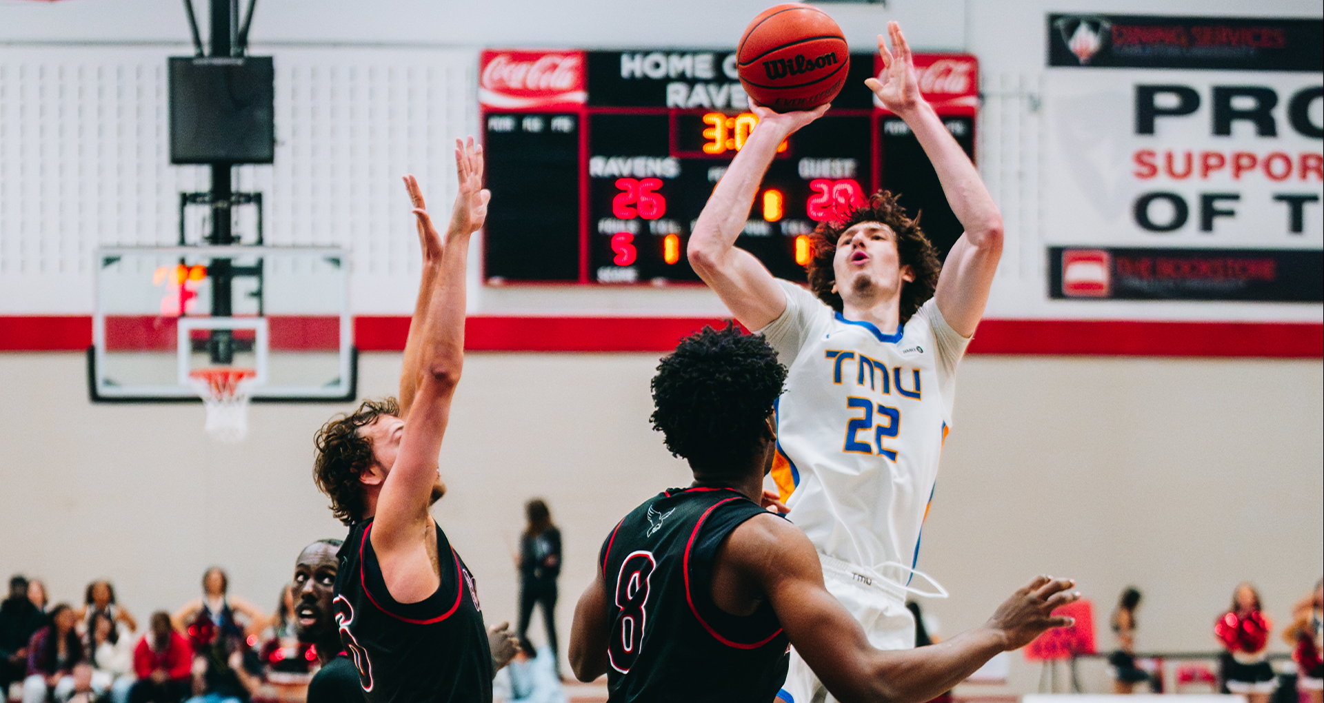 TMU Bold's Aidan Wilson attempts a shot against the Carleton Ravens defence