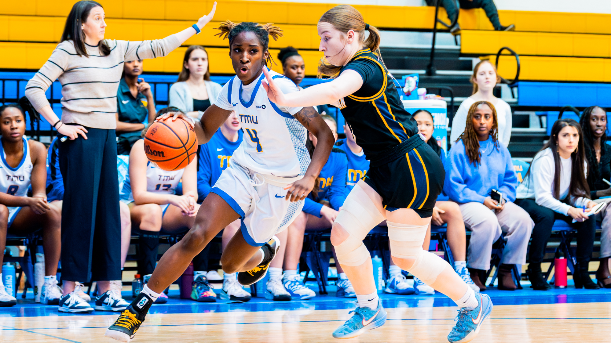 Myriam Kone drives to the basket