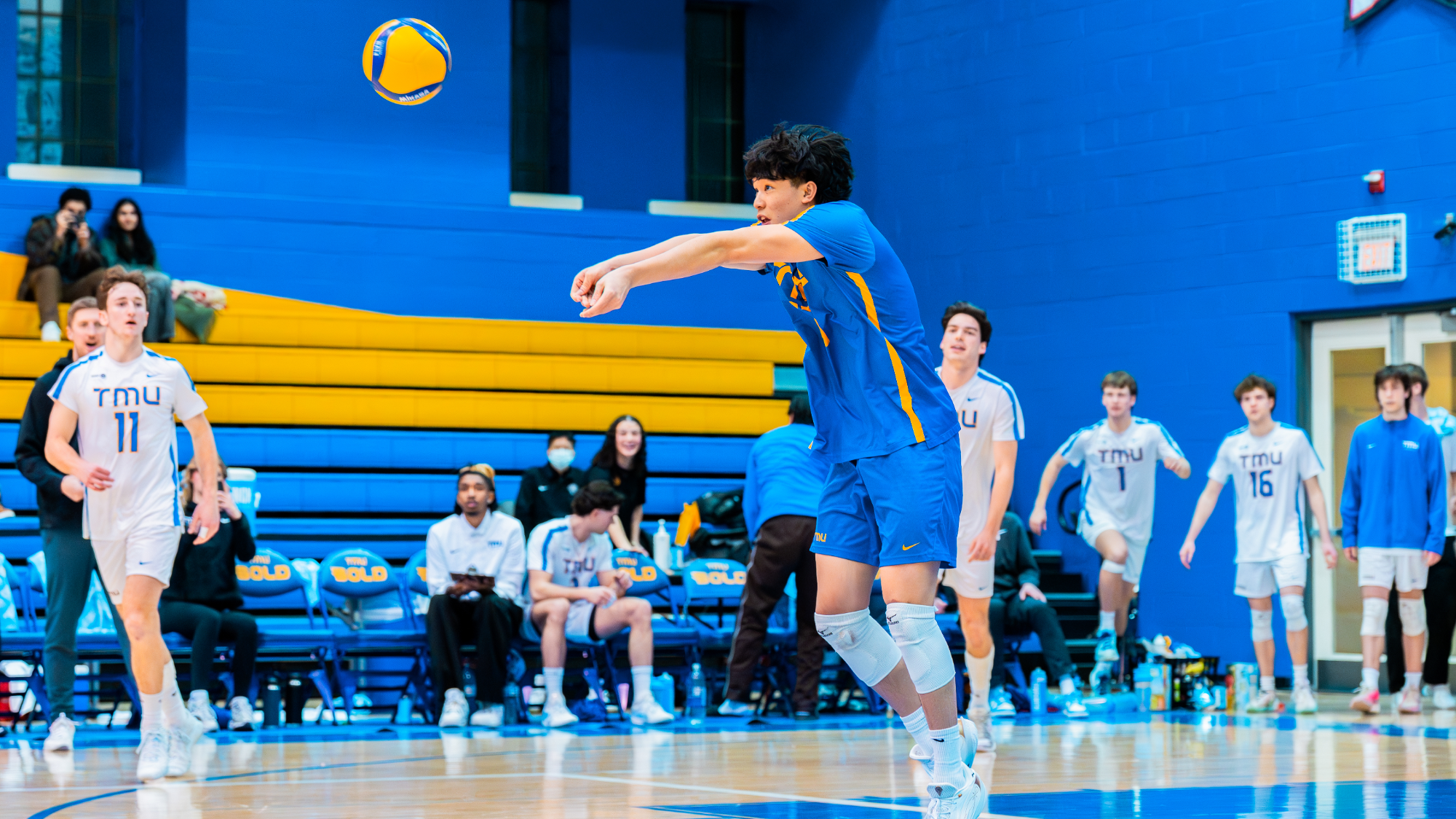 Ethan Lau receives the ball.