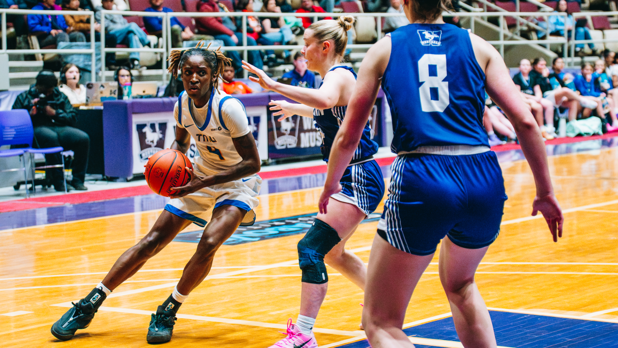 Myriam Kone drives to the basket against Western