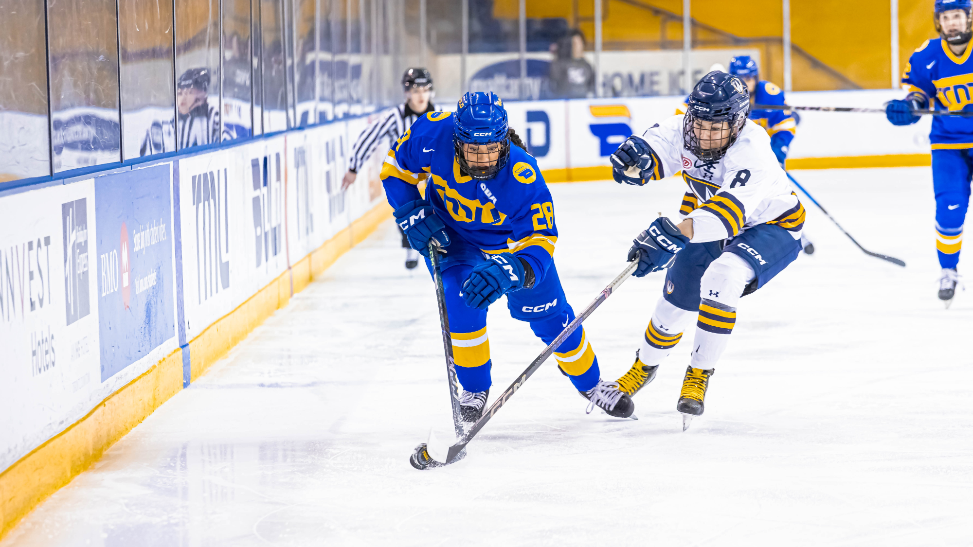 Alizee LeBlanc skates down the ice with the puck