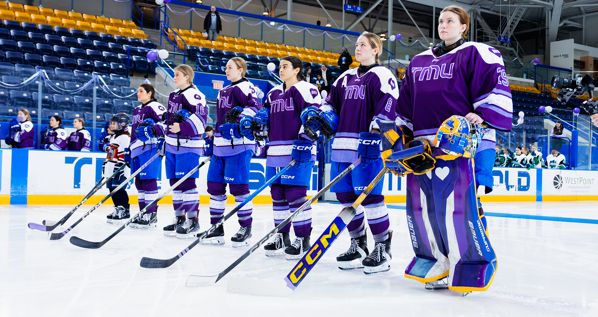 TMU Bold Women's Hockey stand for the national anthem before game against Nipissing Lakers 