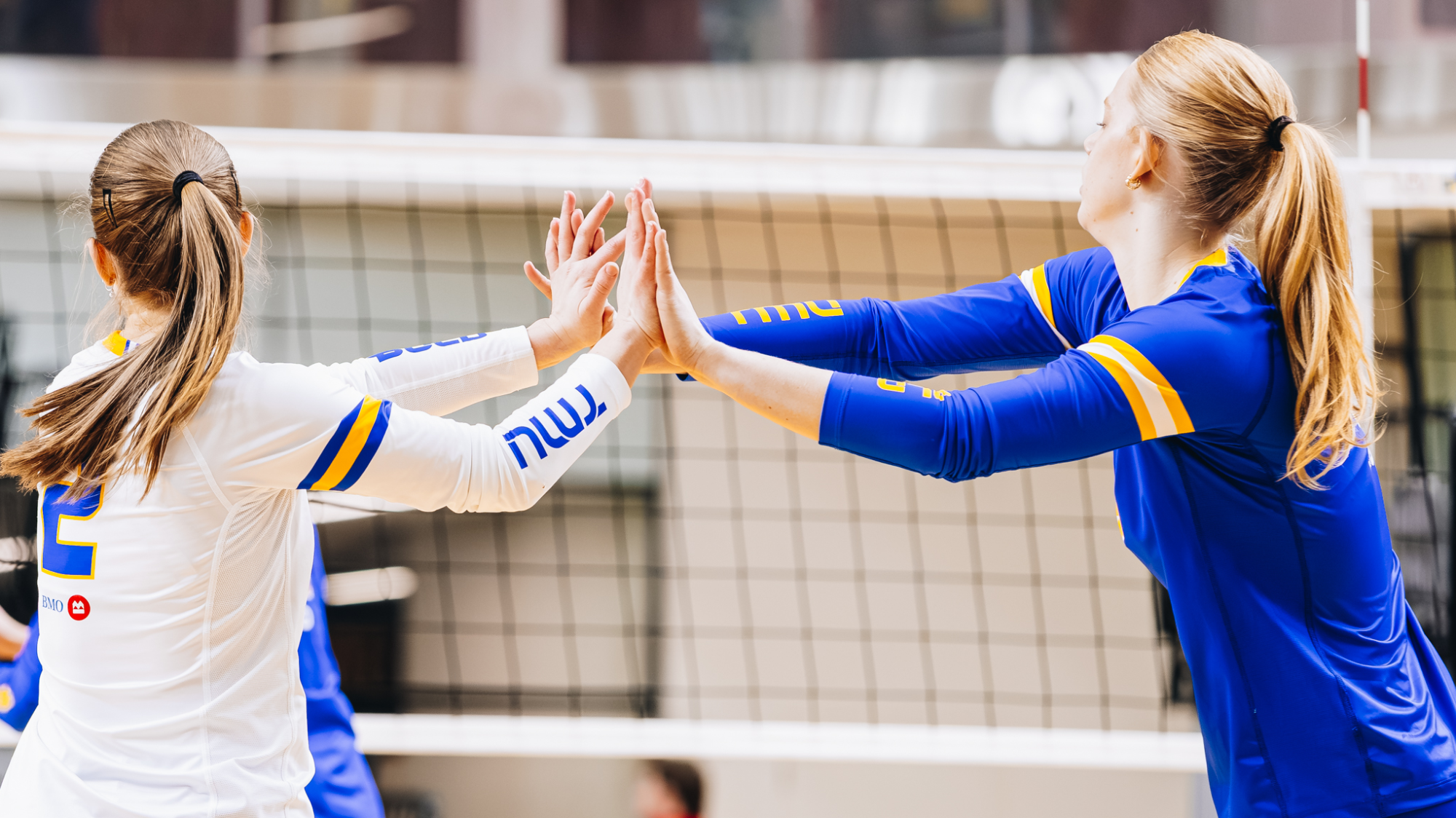 Livia Davenport and Darcie Buchanan high five