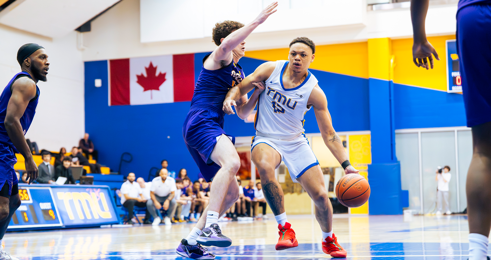 TMU Bold's Aaron Rhooms attacks the basket against the Laurier Golden Hawks.