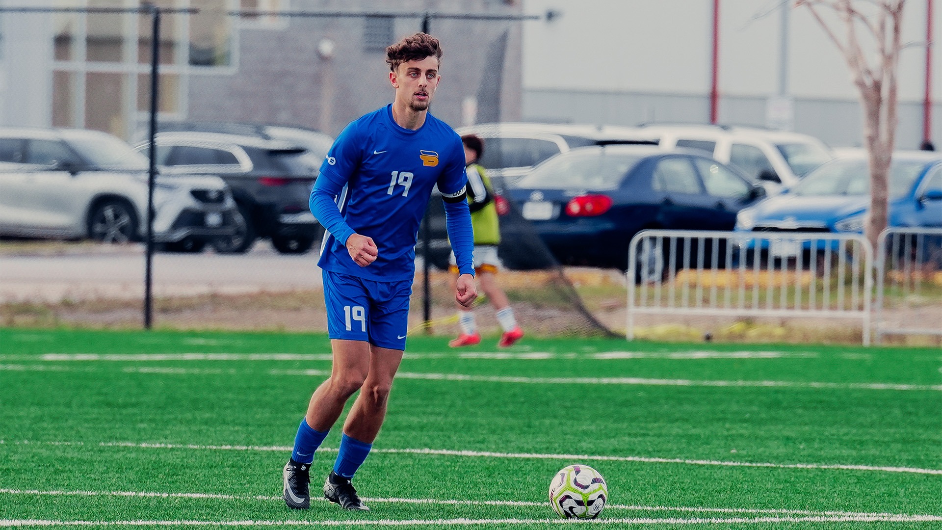 Luca Porfiris dribbling the ball on the field 