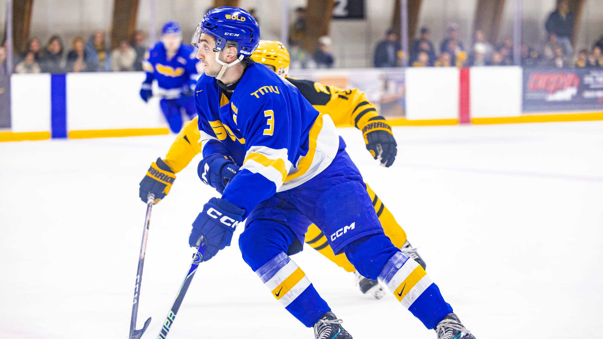 Joseph Ianniello defends the puck against a Waterloo Warrior
