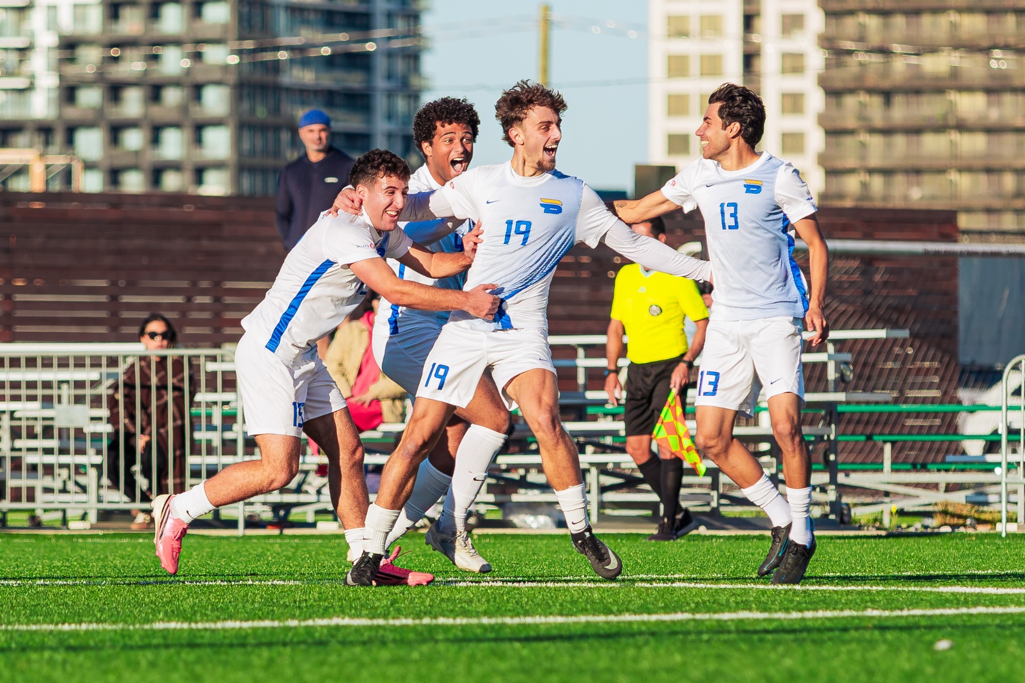Luca Porfiris celebrates with his teammates after scoring from past half against the Ontario Tech Ridgebacks.