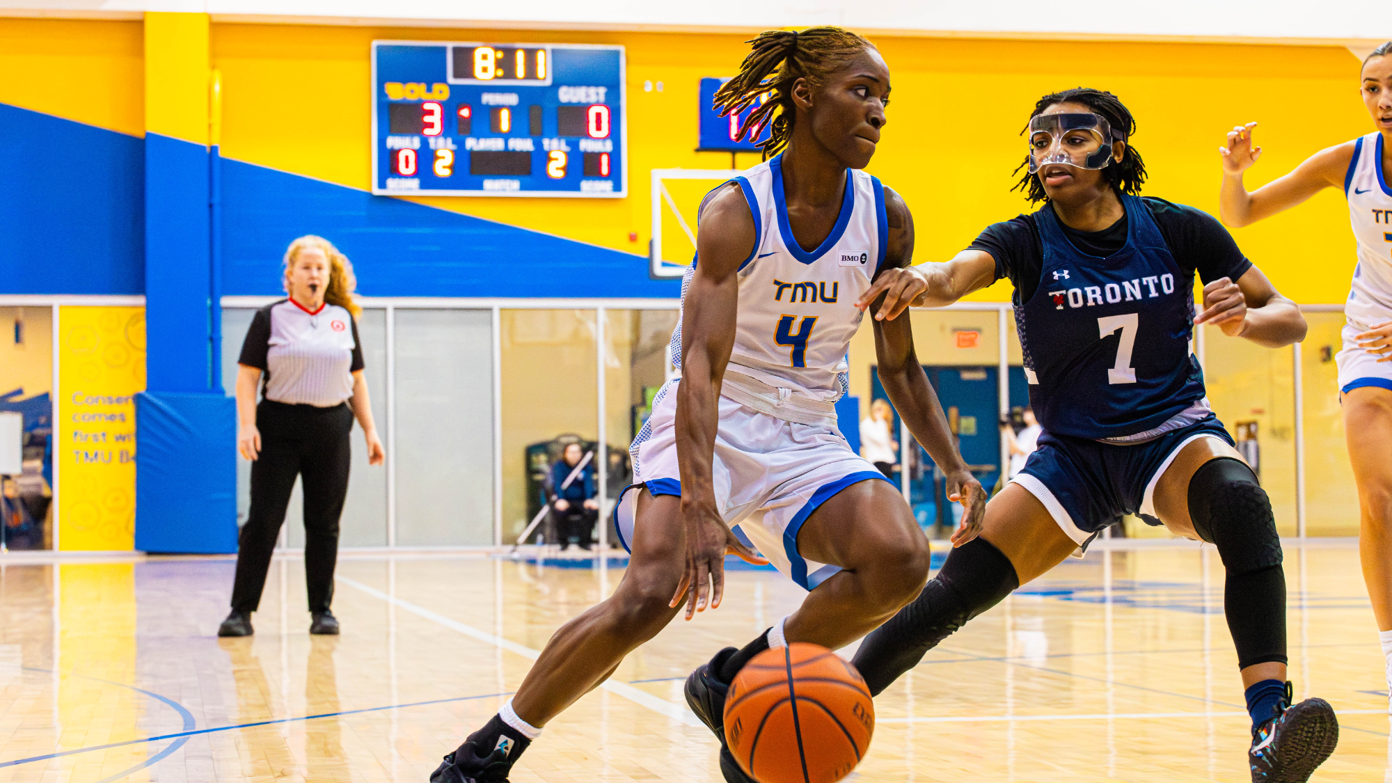 Bold Guard Myriam Kone Drives to the Rim Past a Varsity Blues Defender