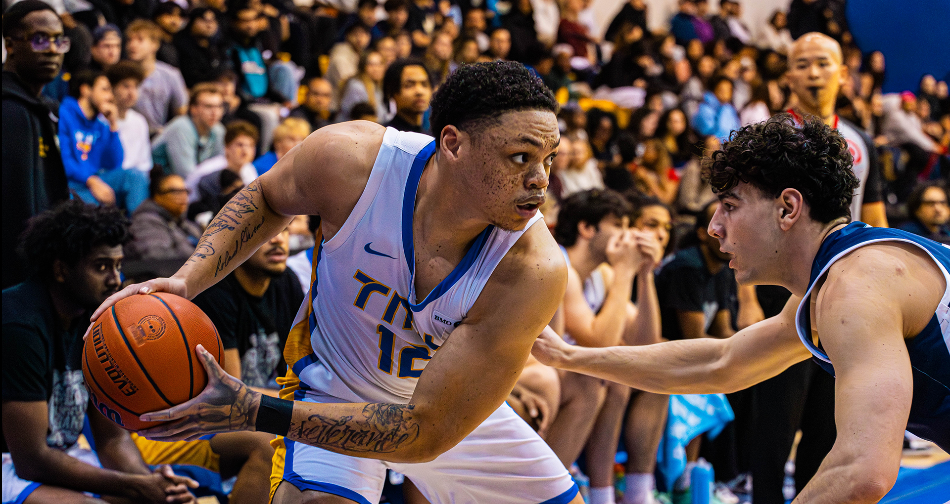 TMU Bold's Aaron Rhooms in the triple threat position against a Varsity Blues defender.