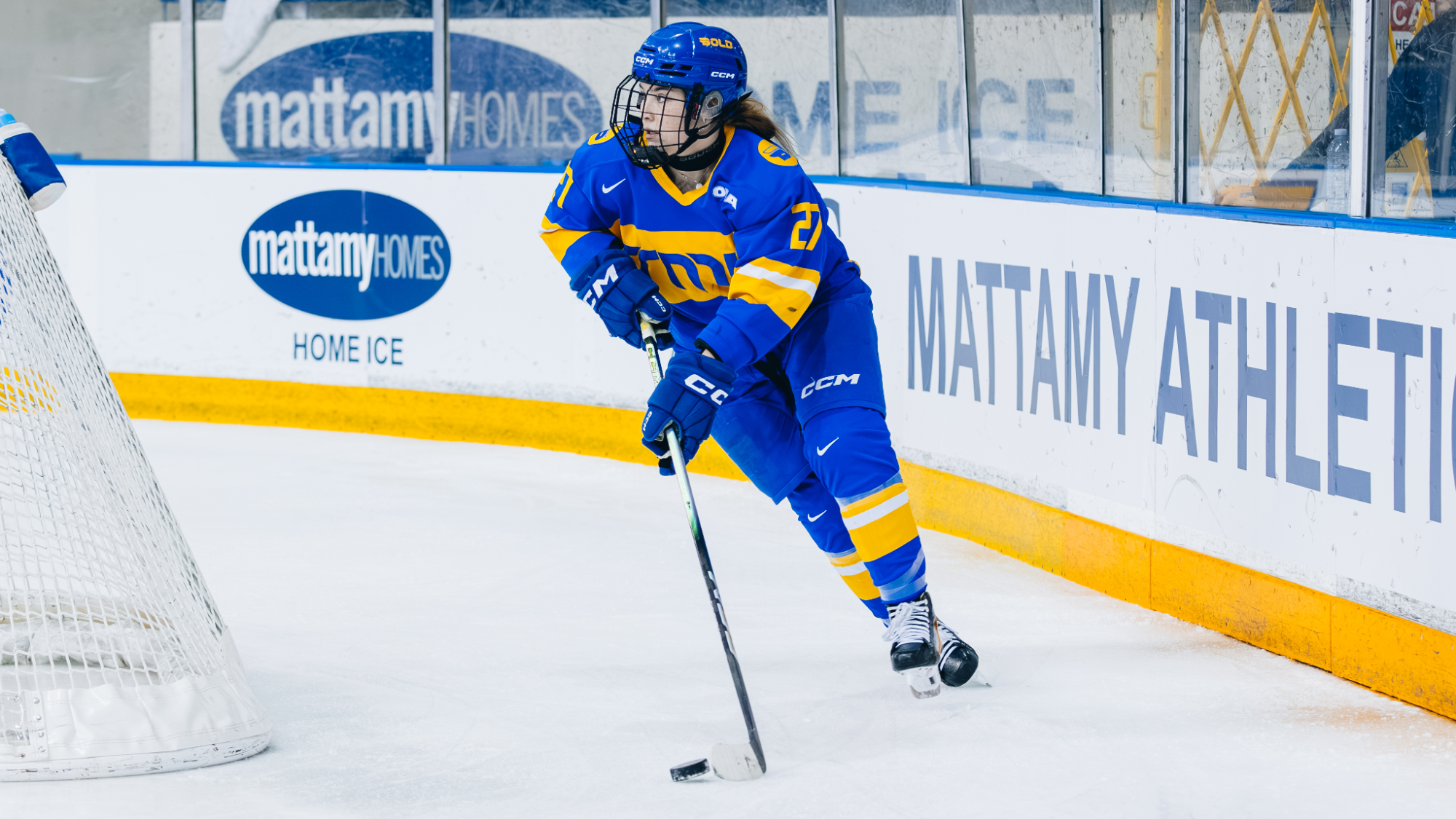 Dayle Chinnick skates with the puck behind the net