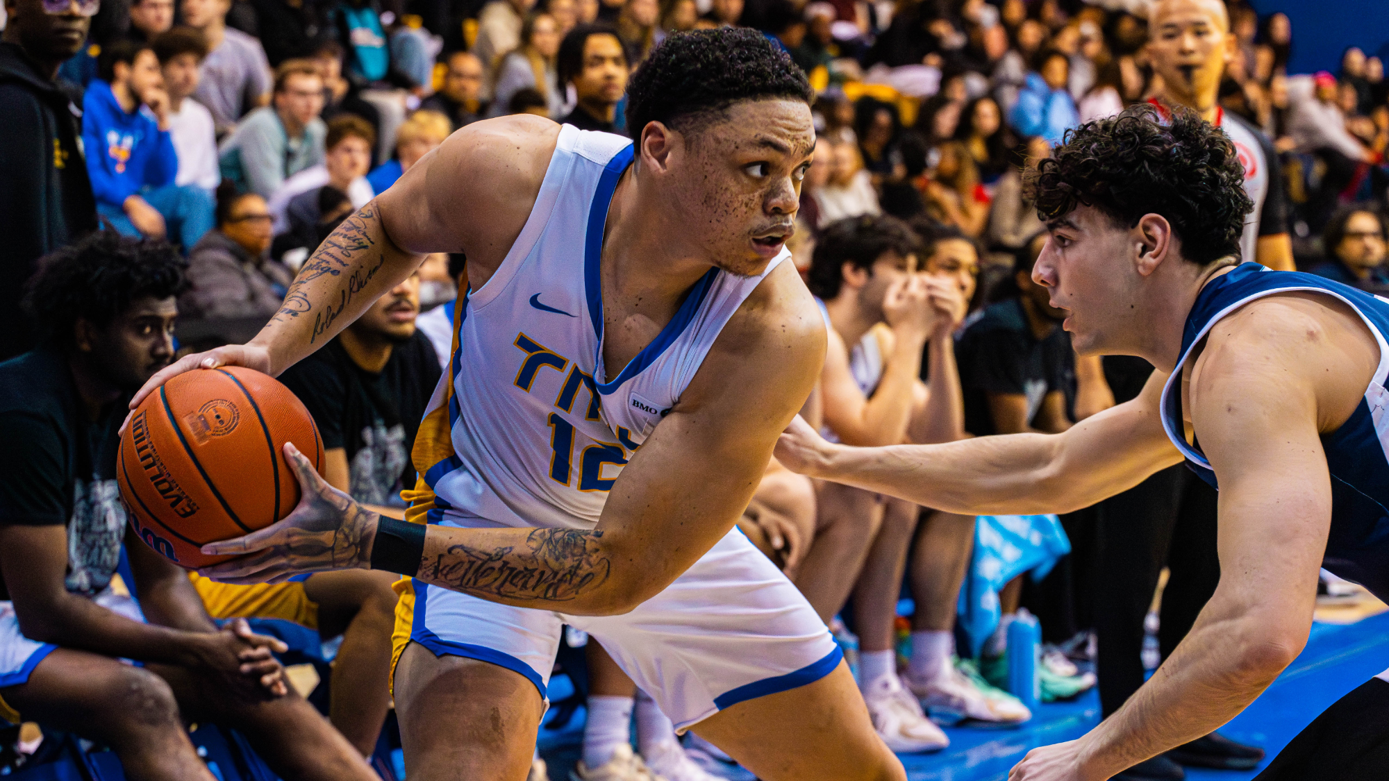 Aaron Rhooms looks at a U of T defender