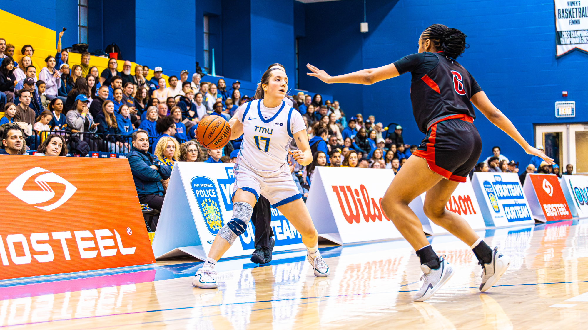 Catrina Garvey dribbles the ball against Carleton