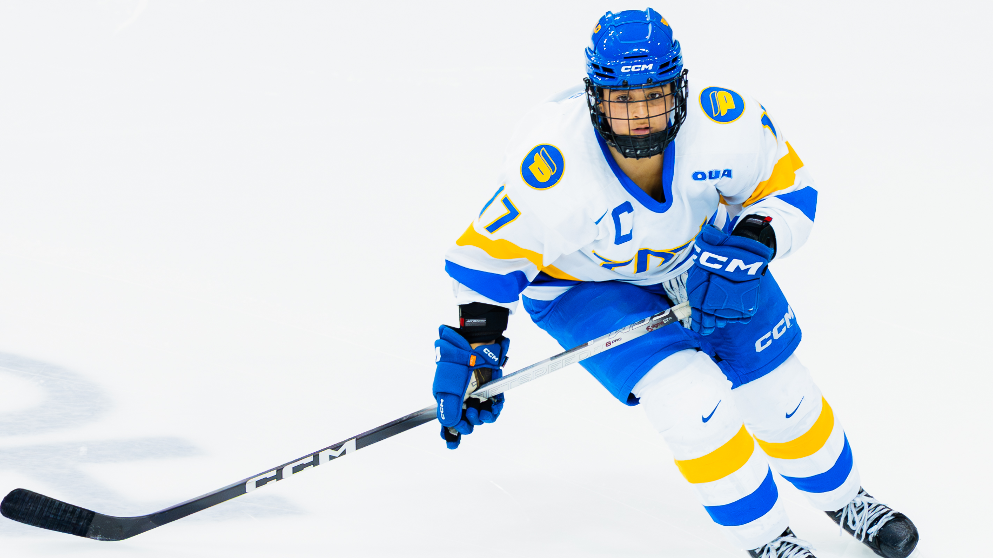 Cailey Davis skates with the puck