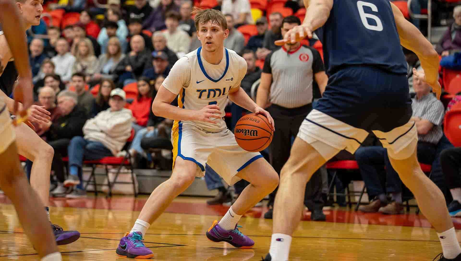 Kevin Toth with the ball against the UBC Thunderbirds