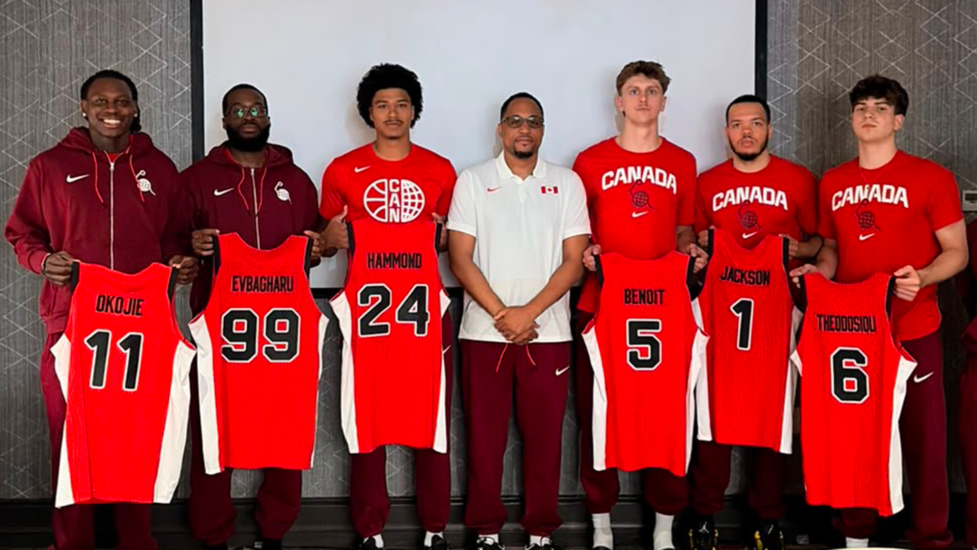 TMU Bold Men's Basketball Lead Assistant Coach and Canada Basketball 3x3 Head CoachJeremie Kayeye stands with his team for photo