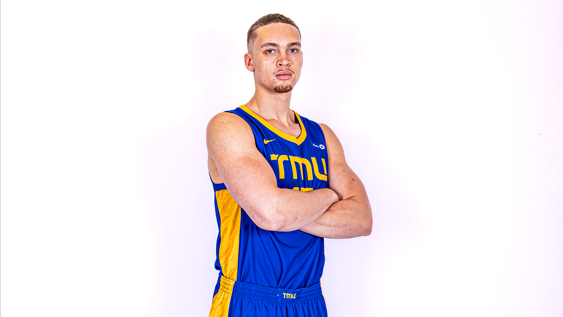 TMU Bold Men's Basketball player Ares Culley-Bremner poses for photo