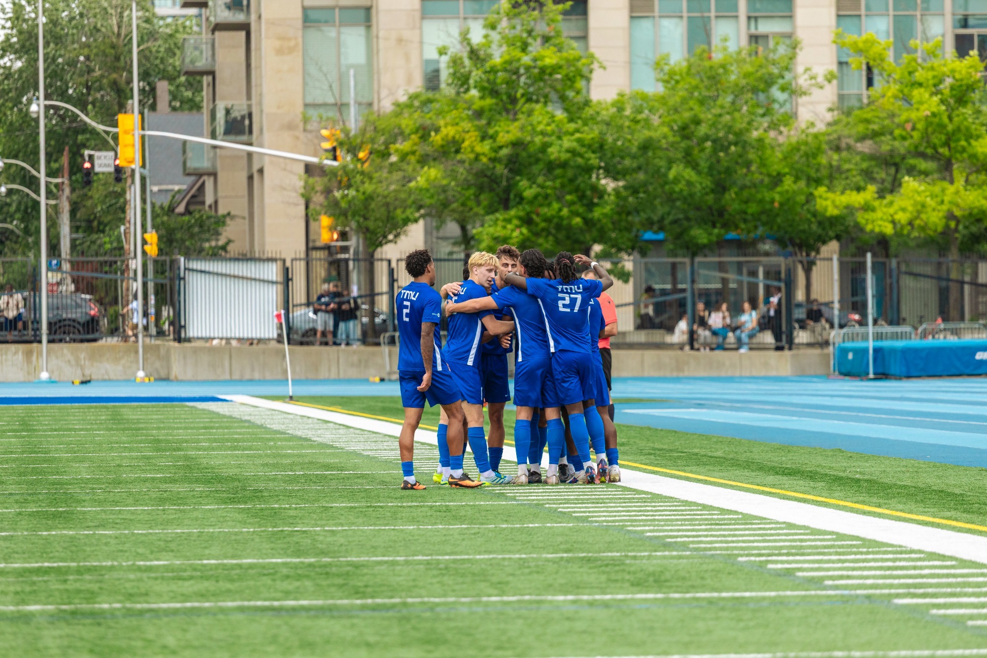 The Bold men's soccer team looks for motivation in a team huddle