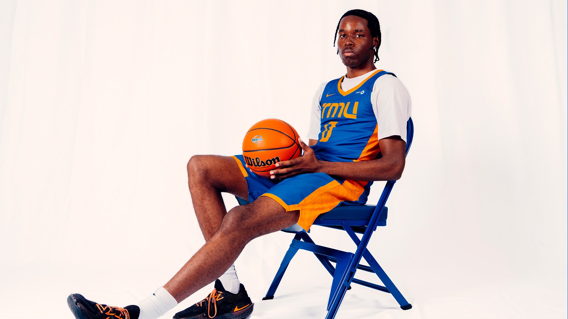 Benni Kazadi sitting on Bold chair during photo shoot at the Mattamy Athletic Chair