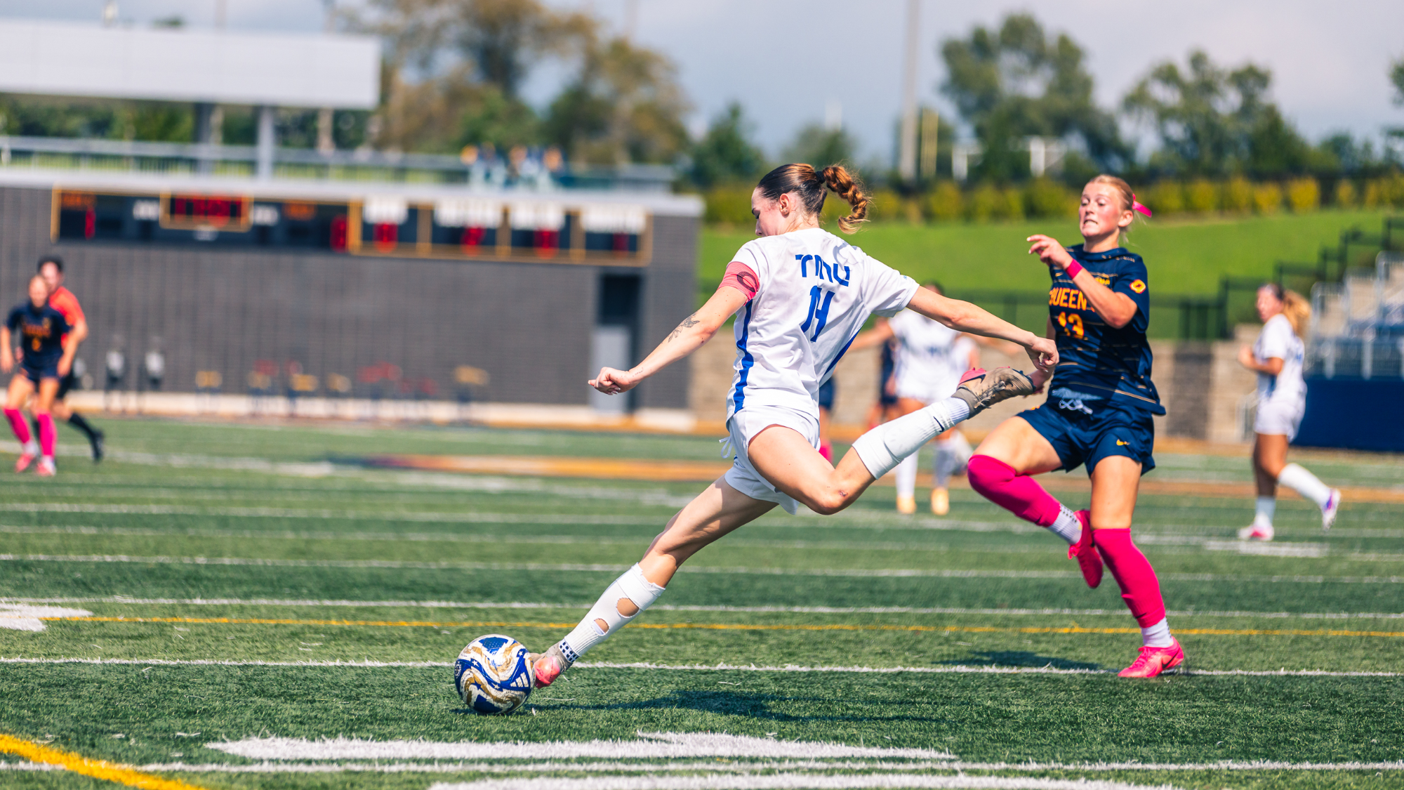 Moynihan with ball against Queen's Gaels