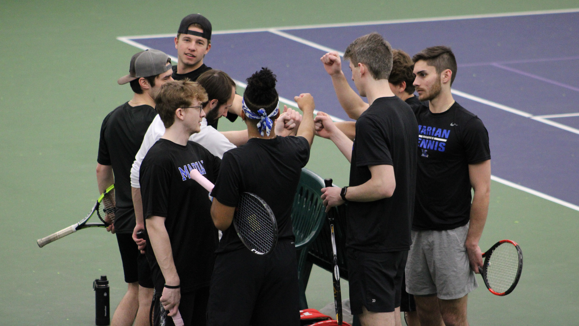 Marian men's tennis huddles in pregame