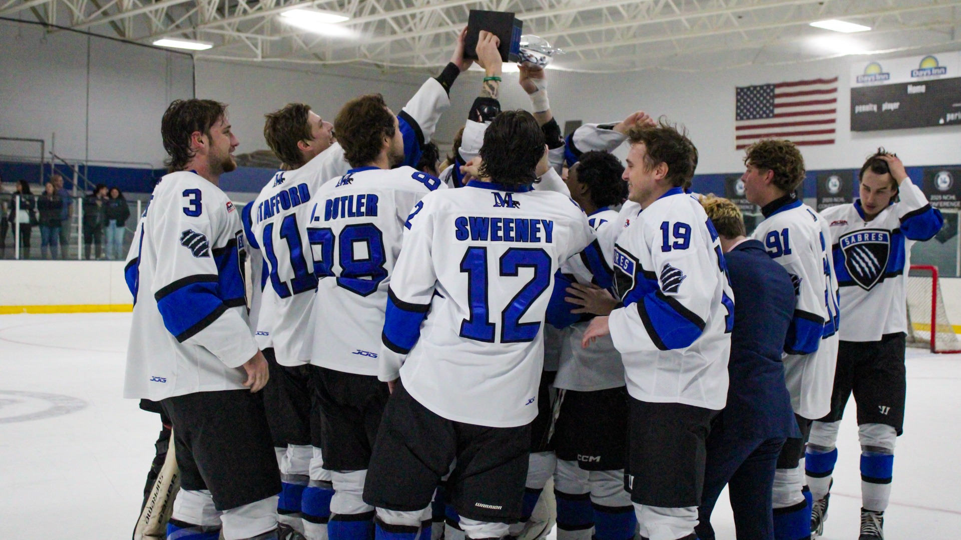Marian celebrates with the Mequondulac Cup
