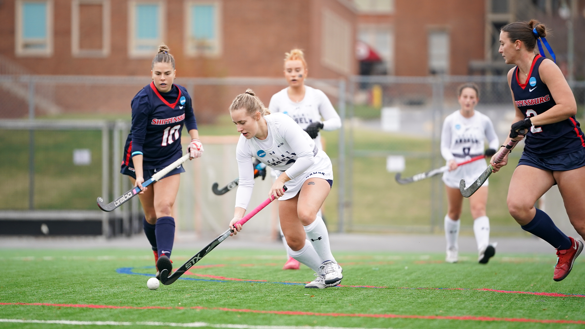 Meghan Carey carries ball up field