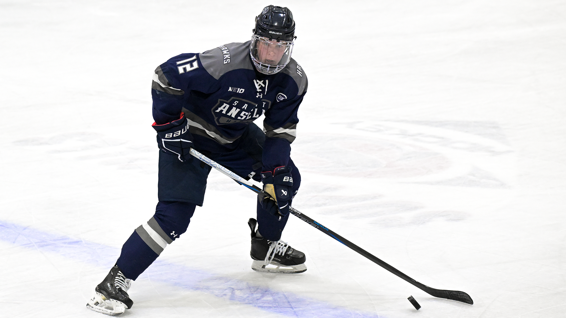 O'Connor skates with puck