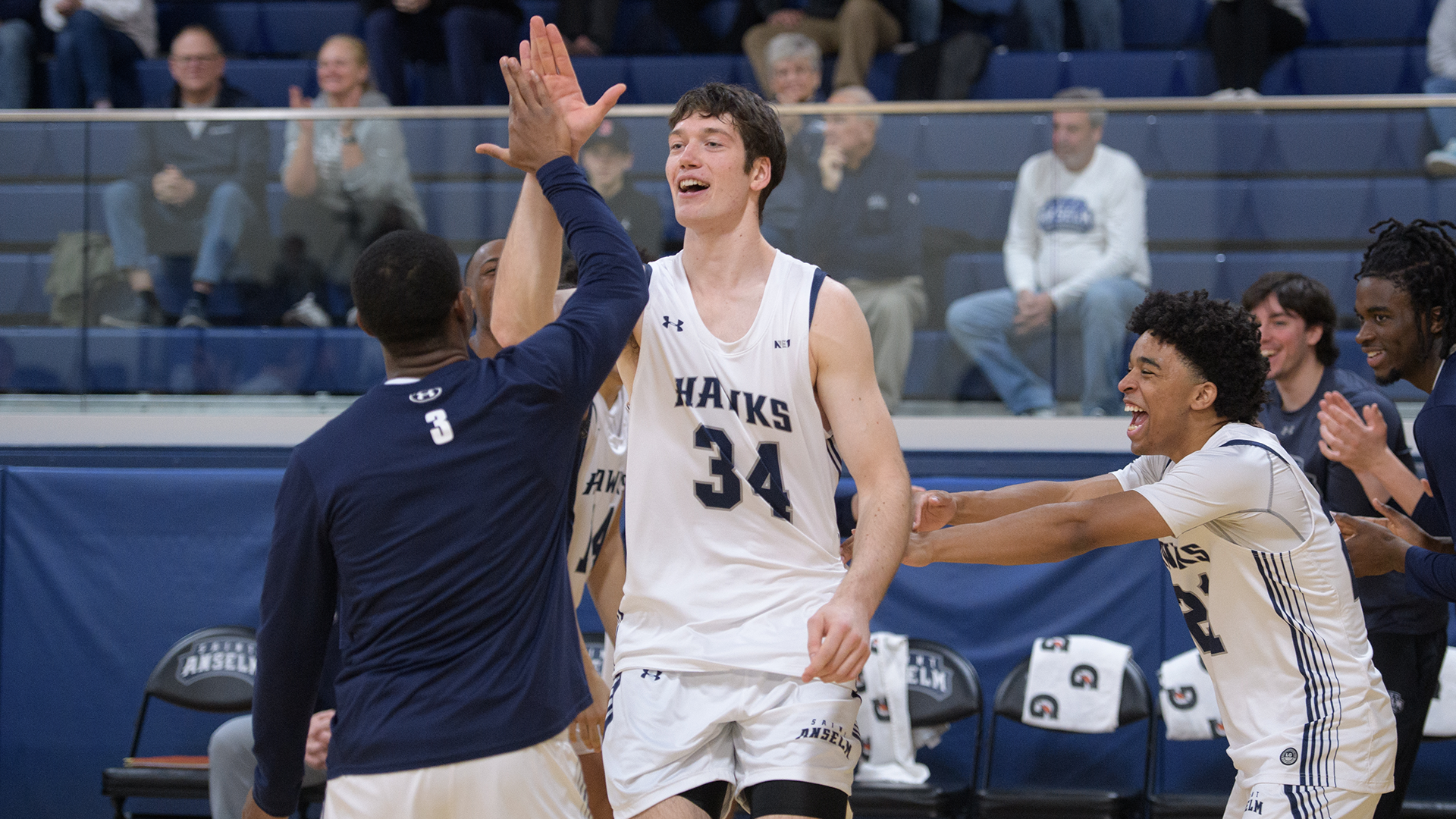 Paulius Rapolis high-fiving teammate during pregame introductions