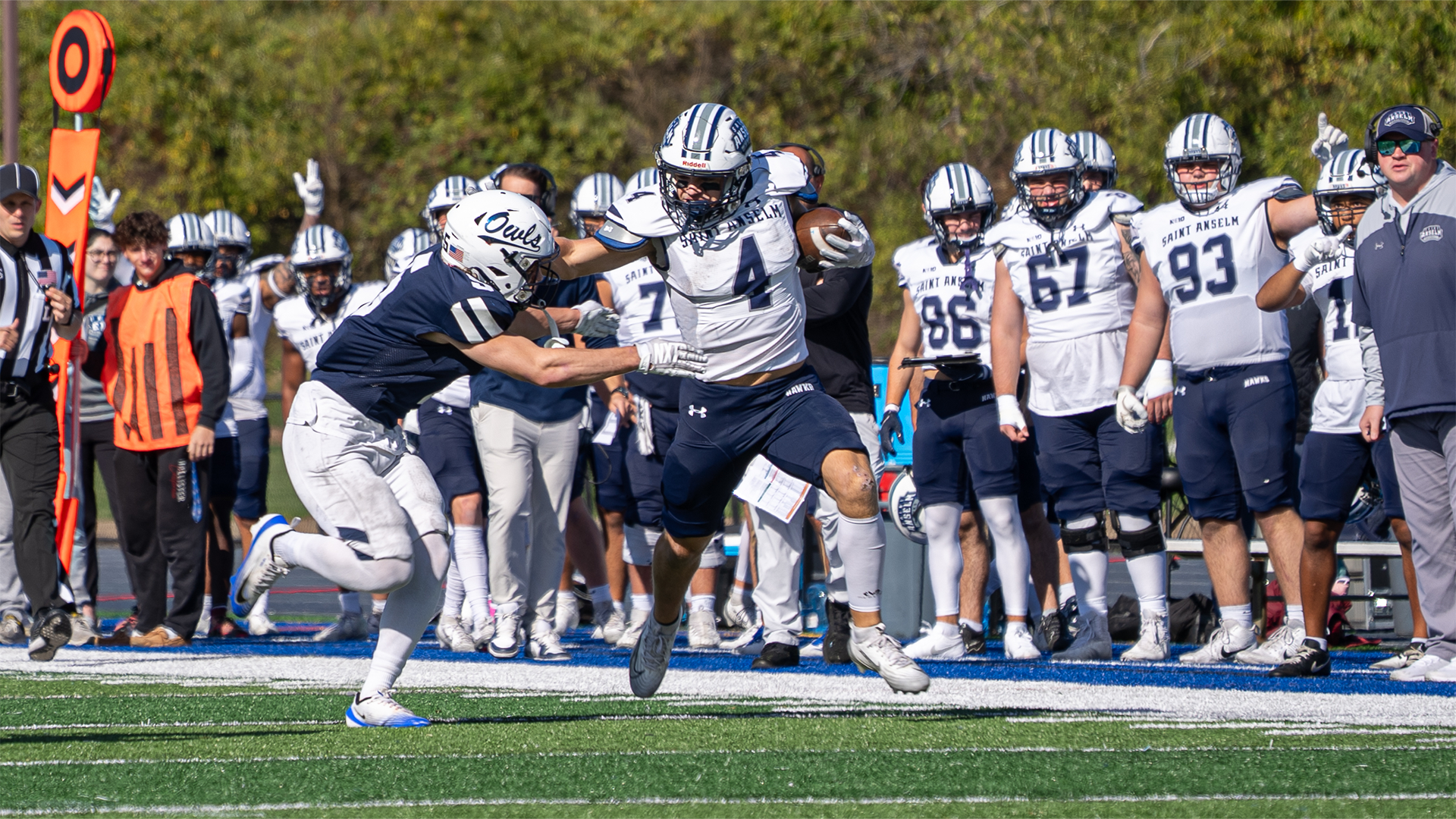 Jake Croce stiff arming opponent