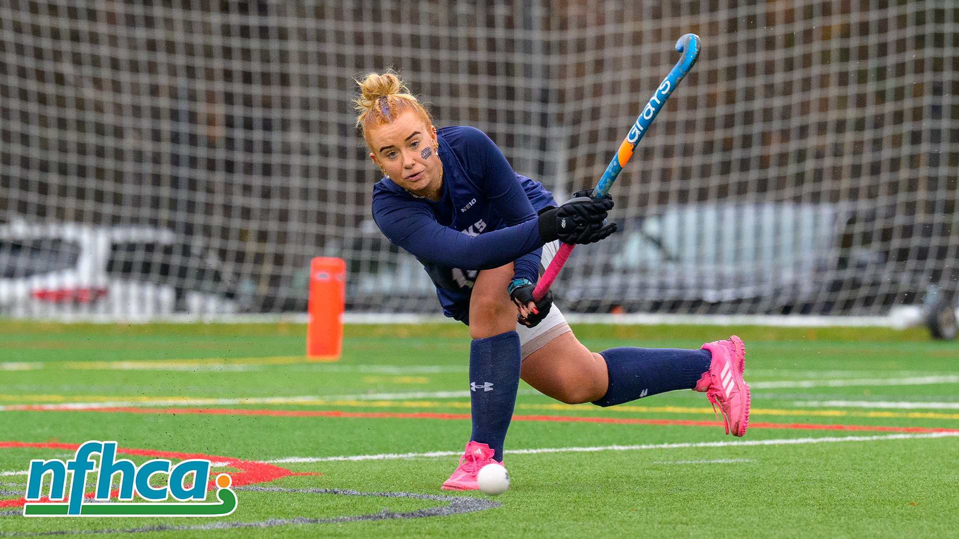 Millie Forster hits ball