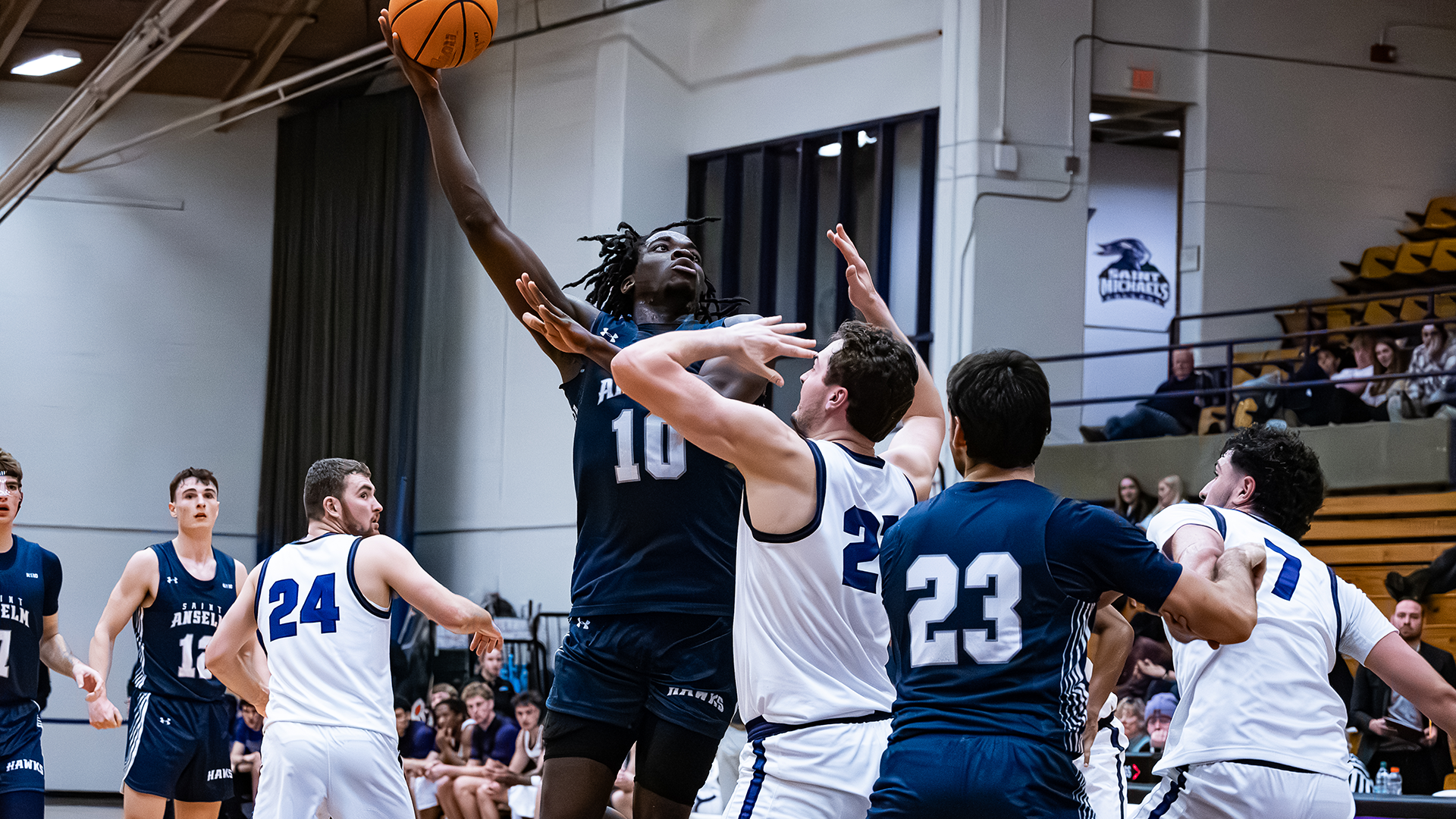 Edward Onyia puts up a hook shot over a Saint Michael's defender