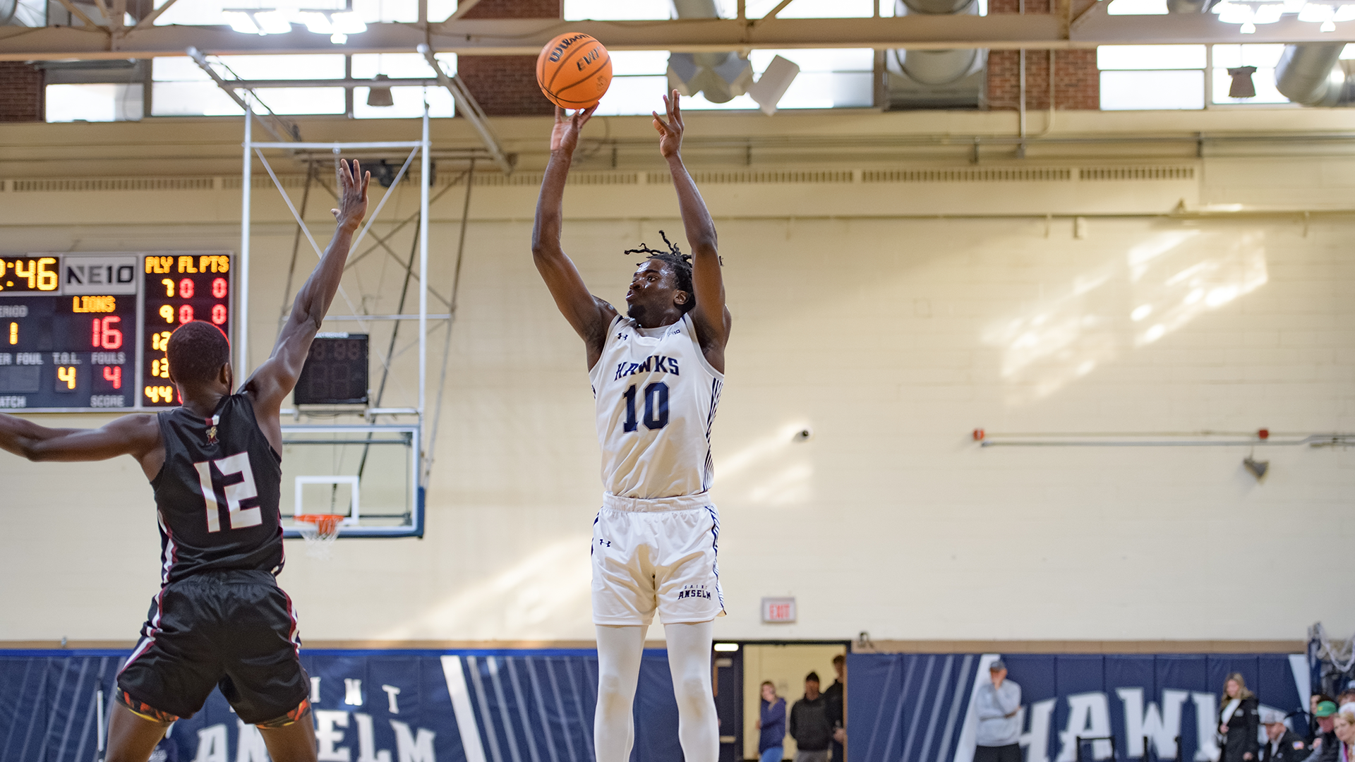 Edward Onyia attempts a three-pointer against Molloy
