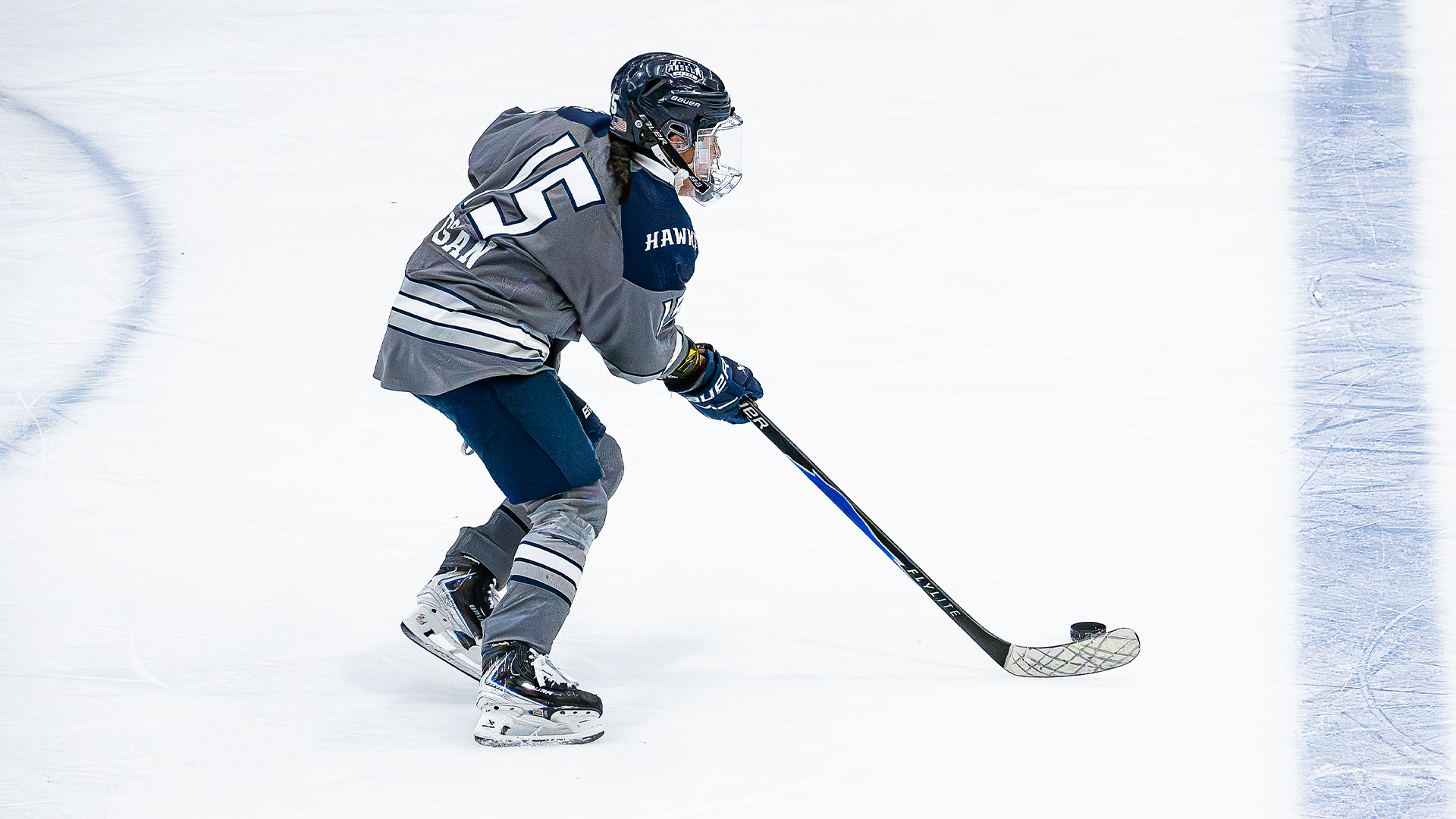 Dogan skates with puck