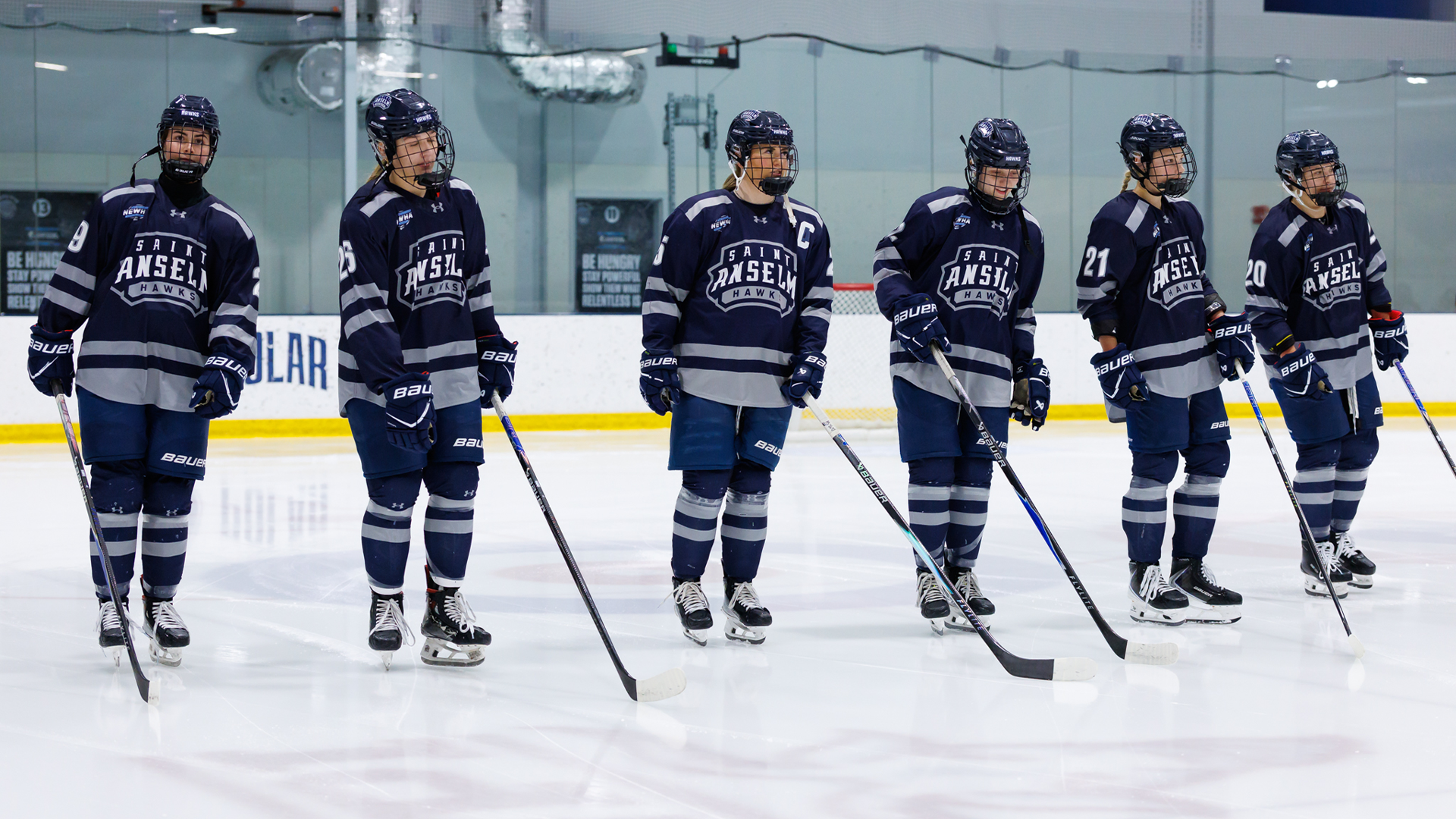 Women's hockey players on blue line