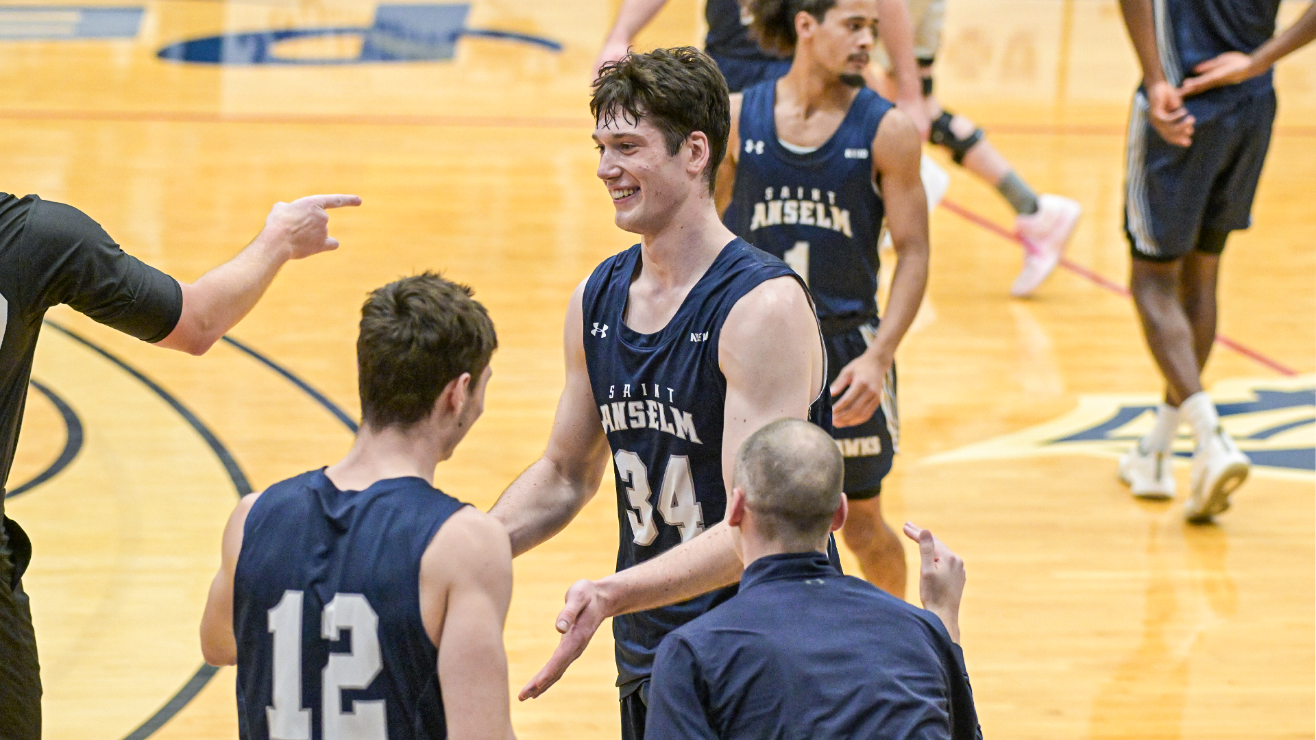 Paulius Rapolis High Fives Teammates at SNHU